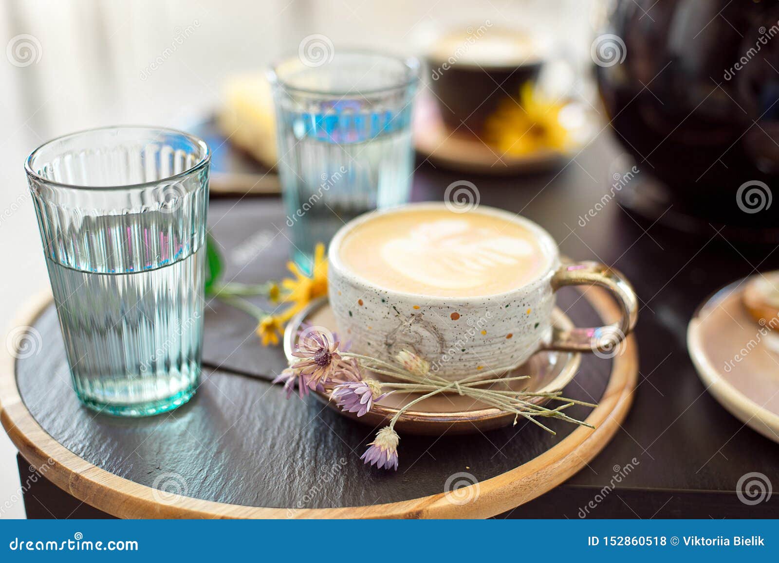 Different Types of Coffee in a Cup on a Dark Table, Two Glasses with