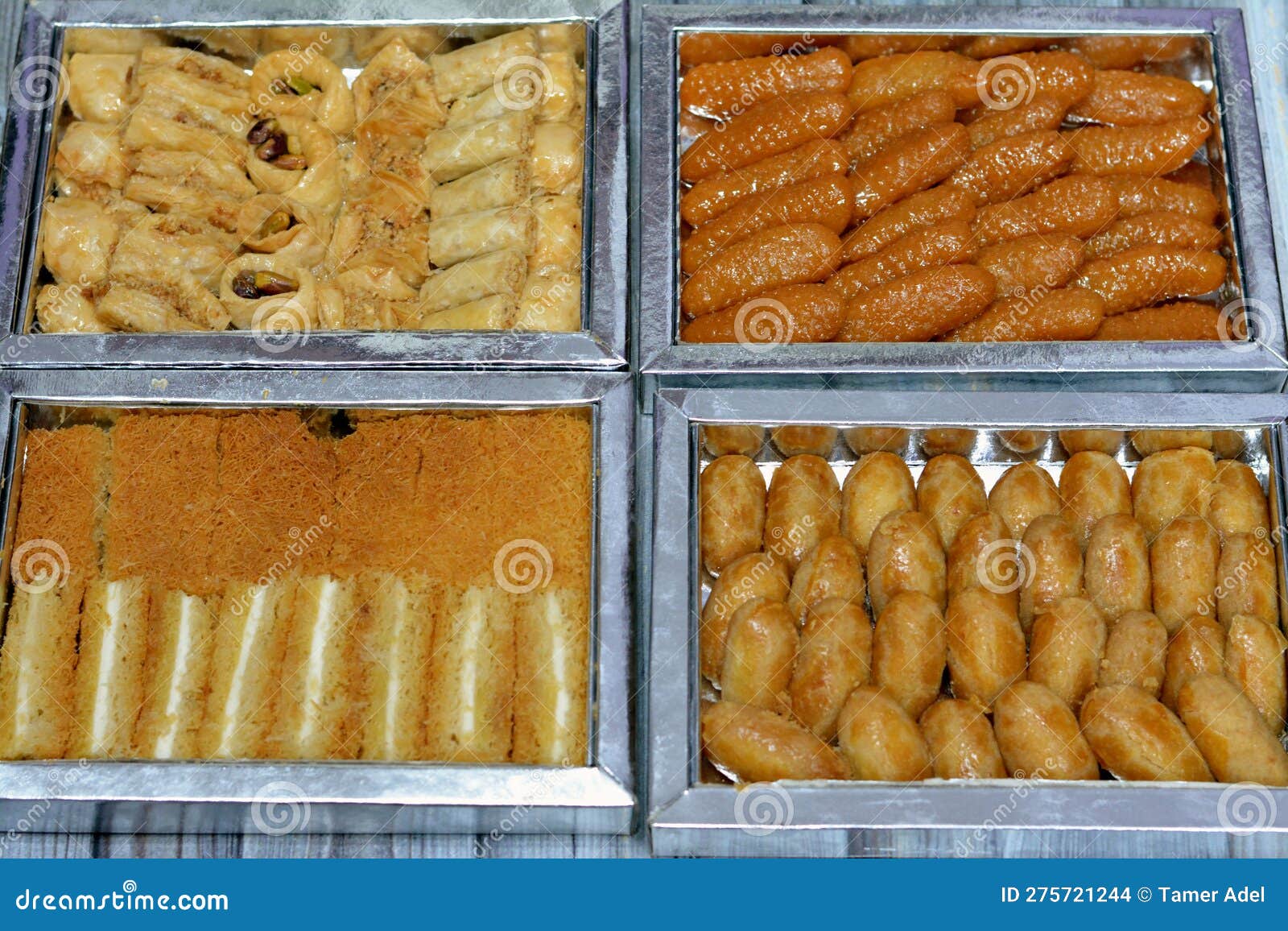 different types of eastern sweets of baklava covered and stuffed with pistachios, sekerpare (romoosh el set)