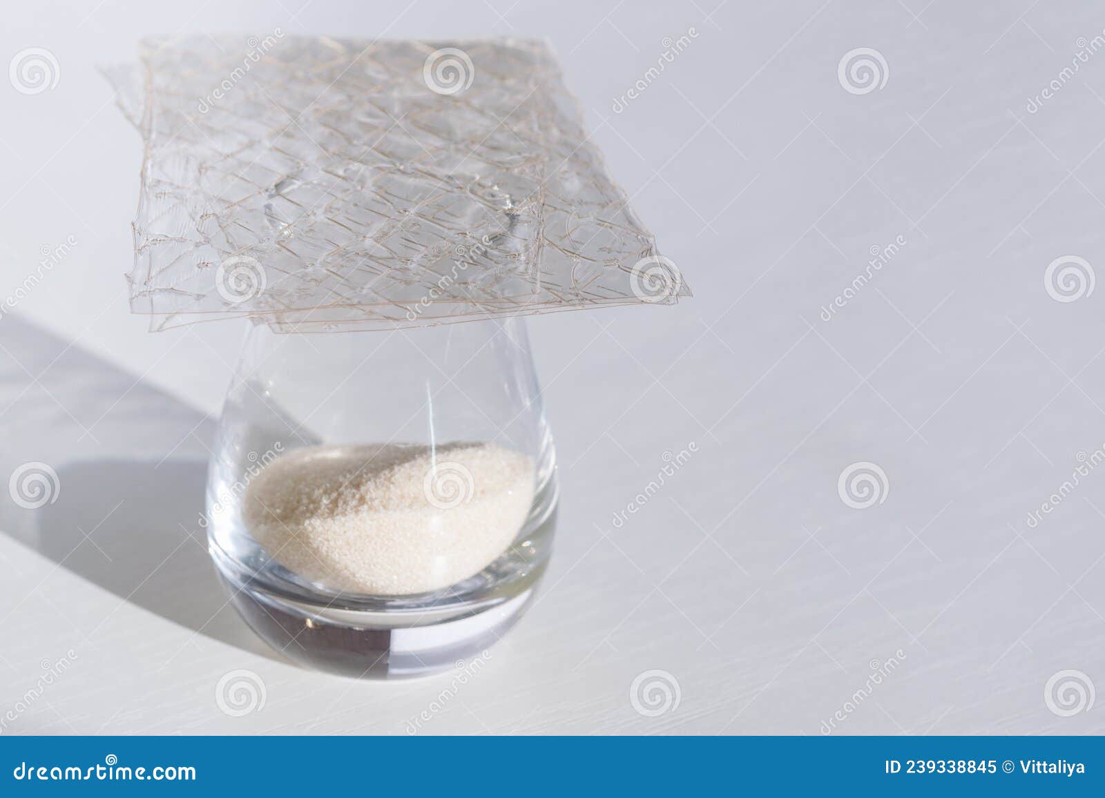 Different Types of Gelatin Powder and Sheets on White Table Stock Image