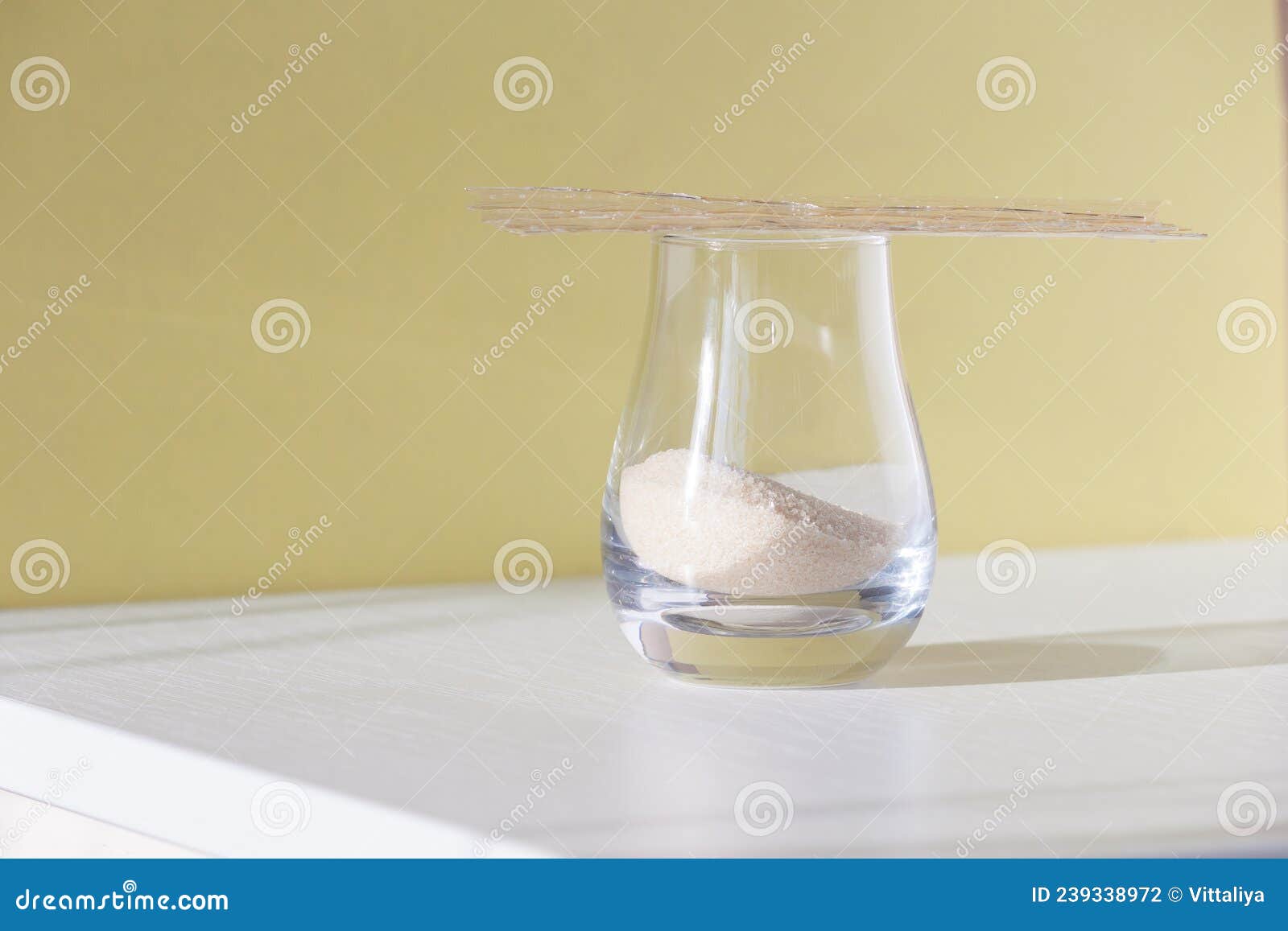 Different Types of Gelatin Powder and Sheets on White Table Stock Photo