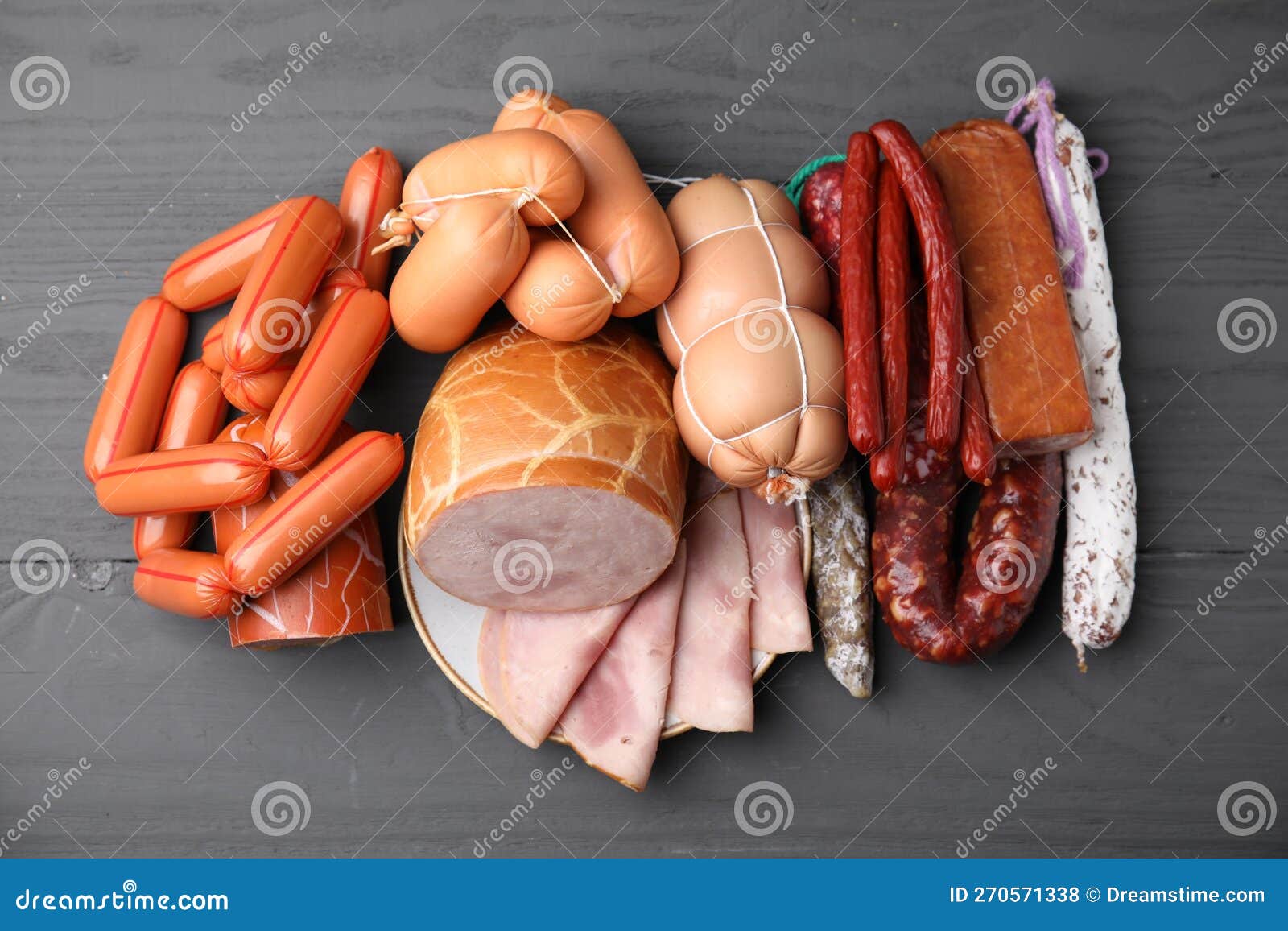 Different Types of Sausages on Light Grey Wooden Table, Above View