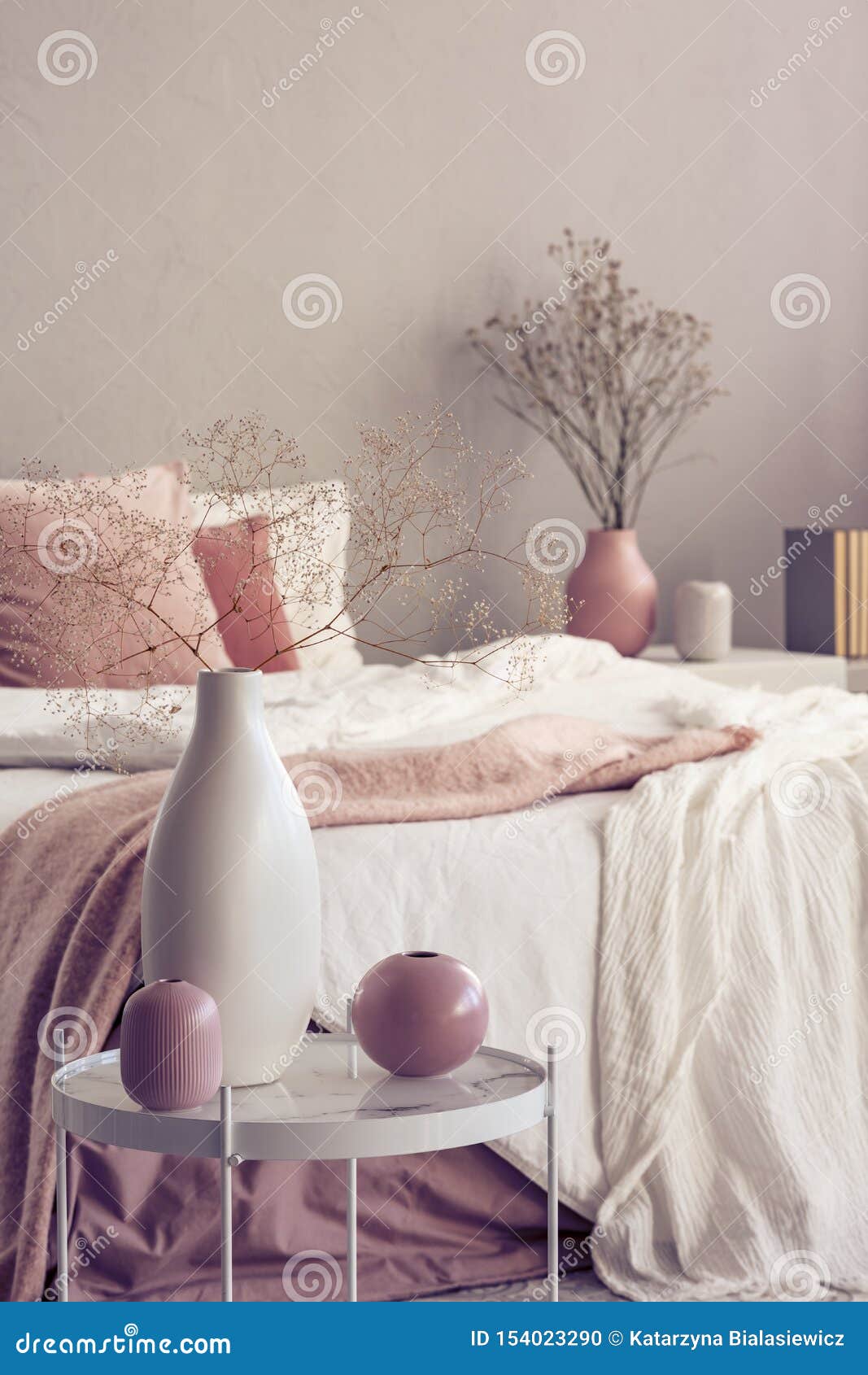 Different Types of Vases on Small Coffee Table in Bright Bedroom