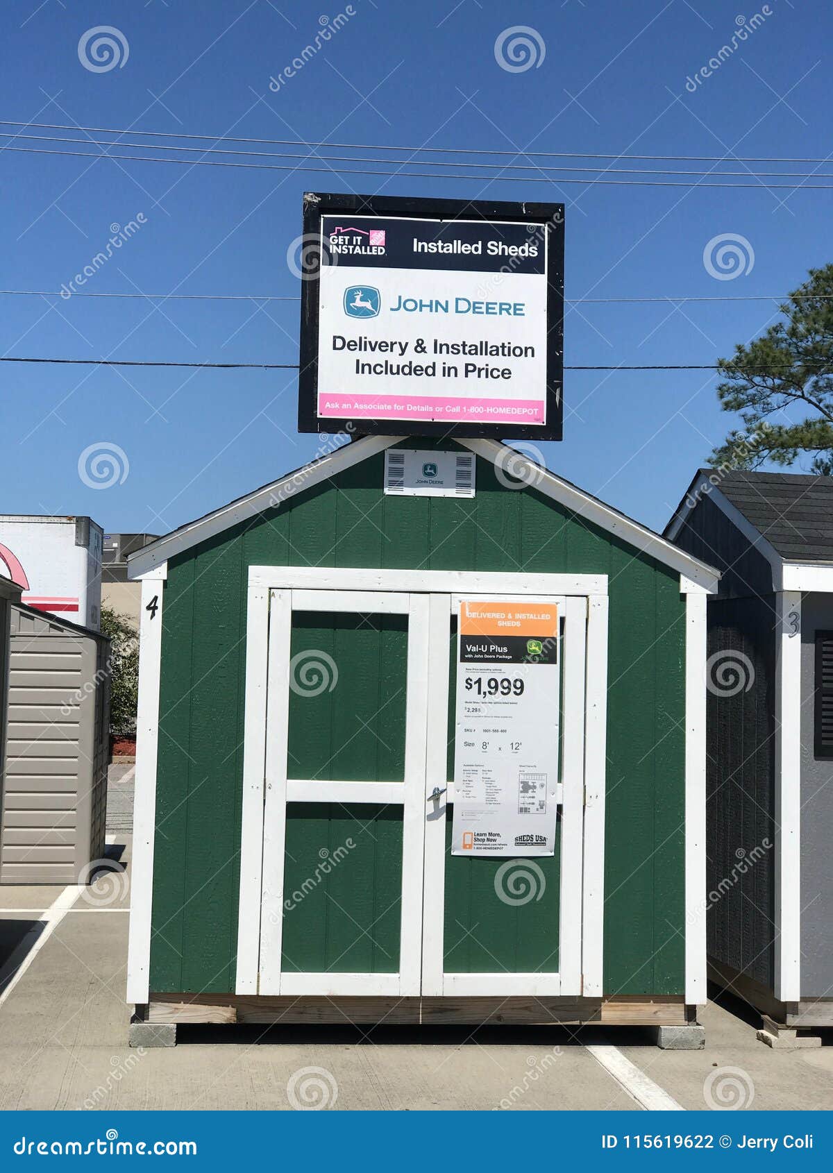 Different Varieties of Sheds on Display in a Parking Lot of a Chain