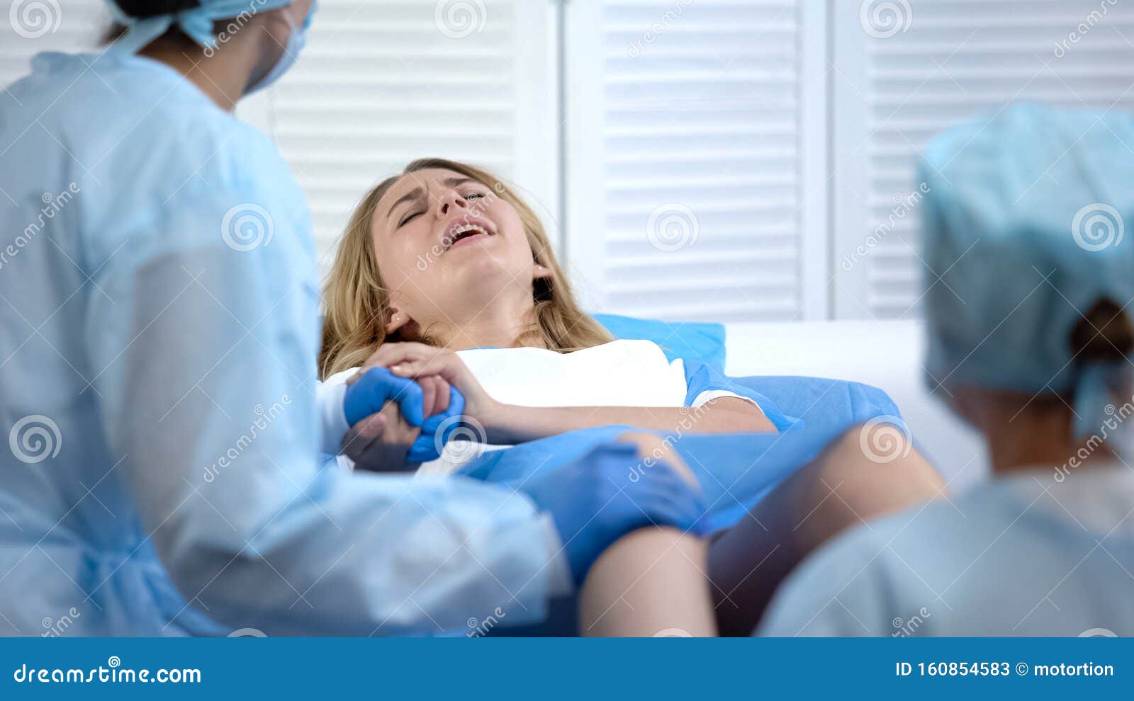 difficult child birth process, obstetricians supporting female, natural labour