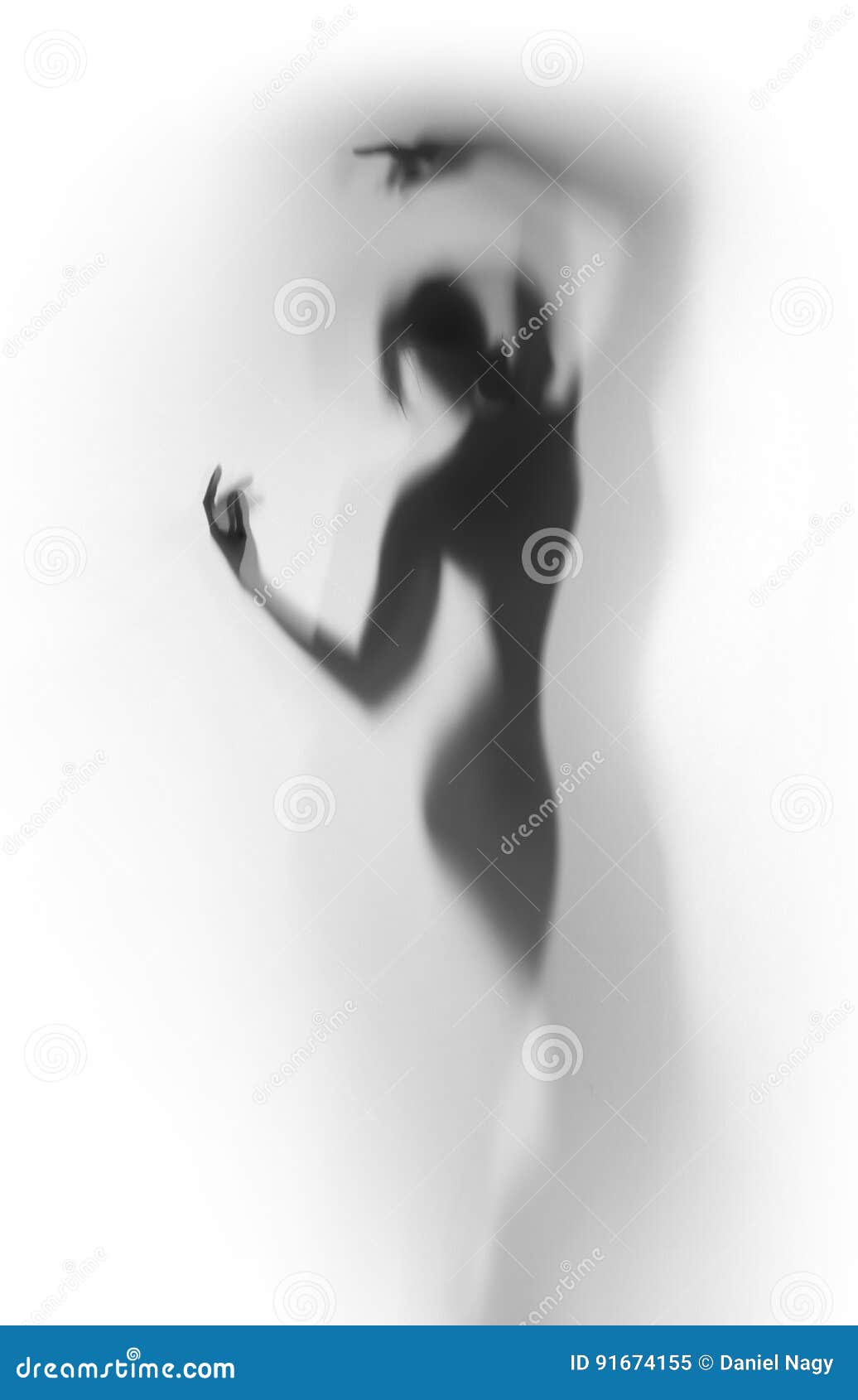 diffuse silhouette of a beautiful dancer woman behind a curtain