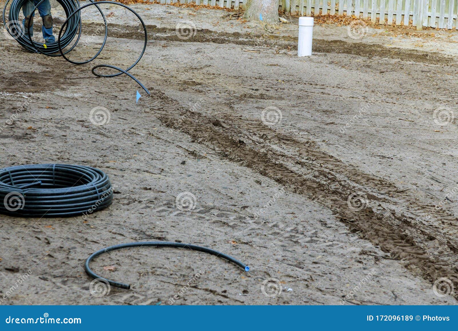 Digging in the Ground Lay Water Pipe for Irrigation System Stock Image