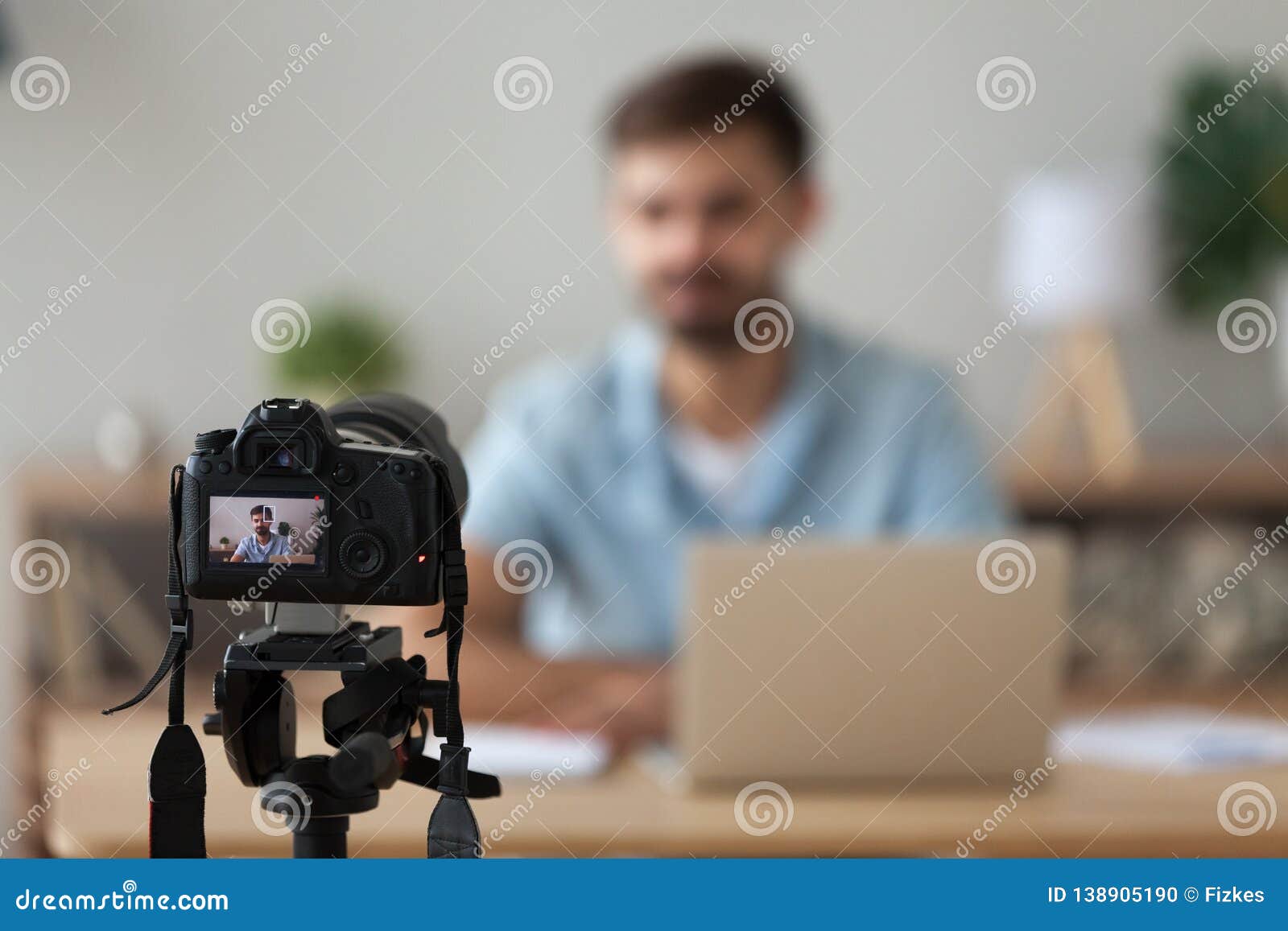 digital camera filming commercial vlog of man teacher vlogger coach