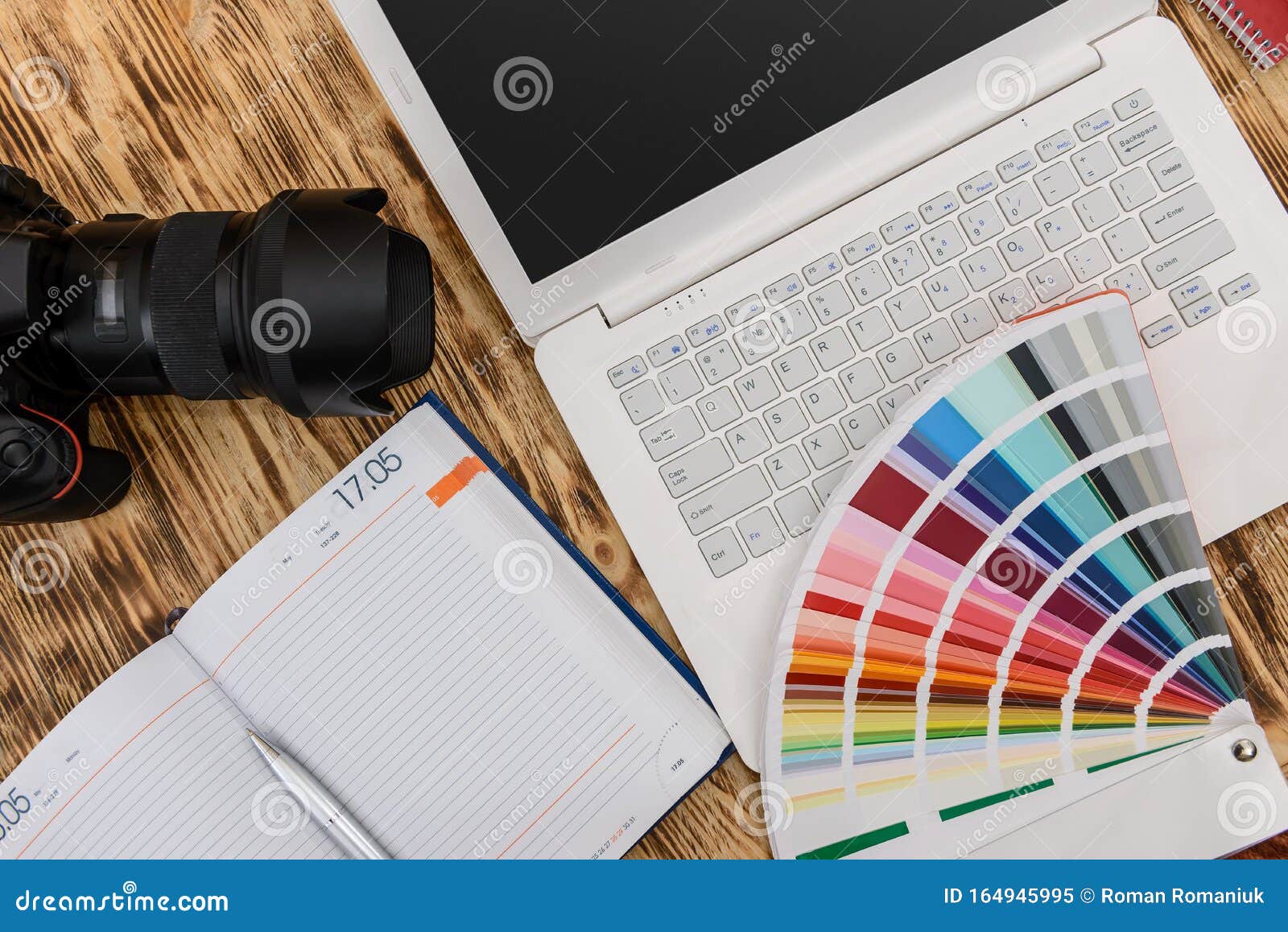 Digital Camera with Laptop and Color Sampler on Desk Stock Image