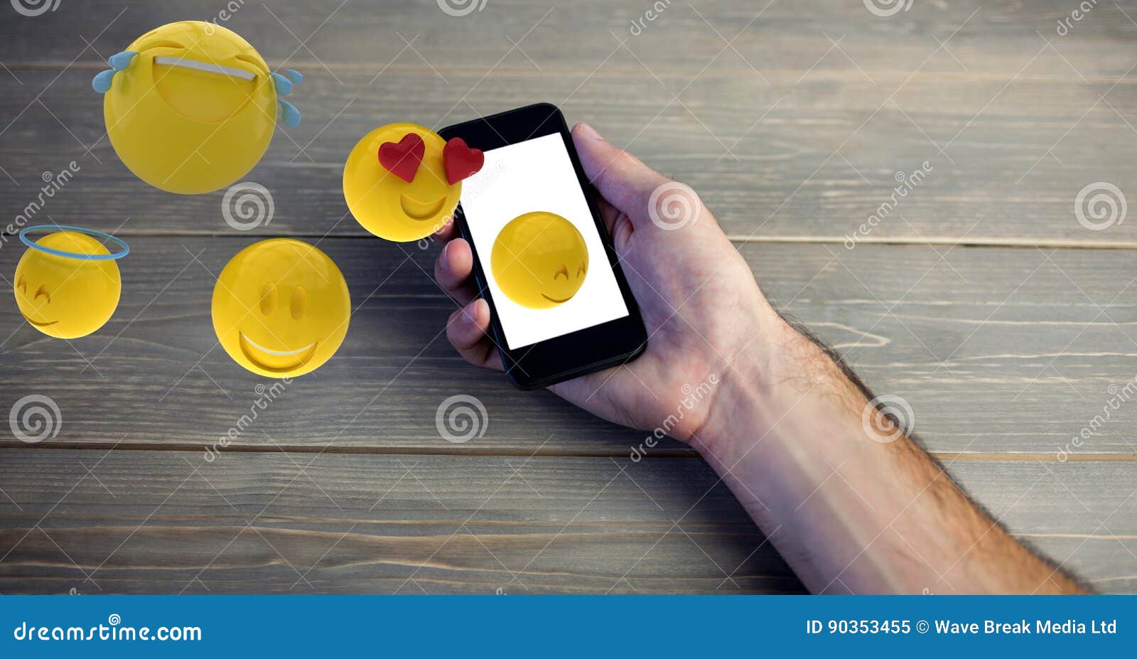 Digital Composite Image of Hand Holding Smart Phone while Emojis Coming