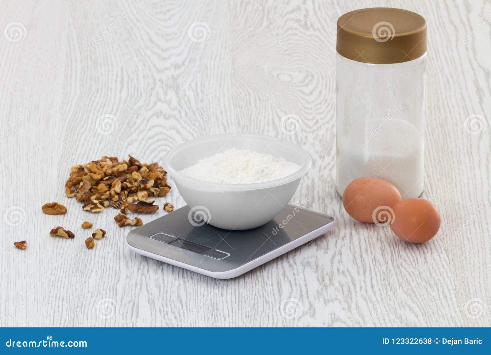 Digital Kitchen Scale in the Kitchen with Cake Ingredients Stock Photo
