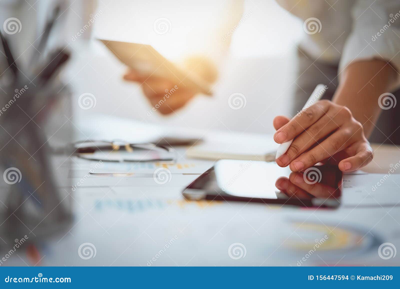 digital marketing, businessman using digital tablet and documents on office desk background.