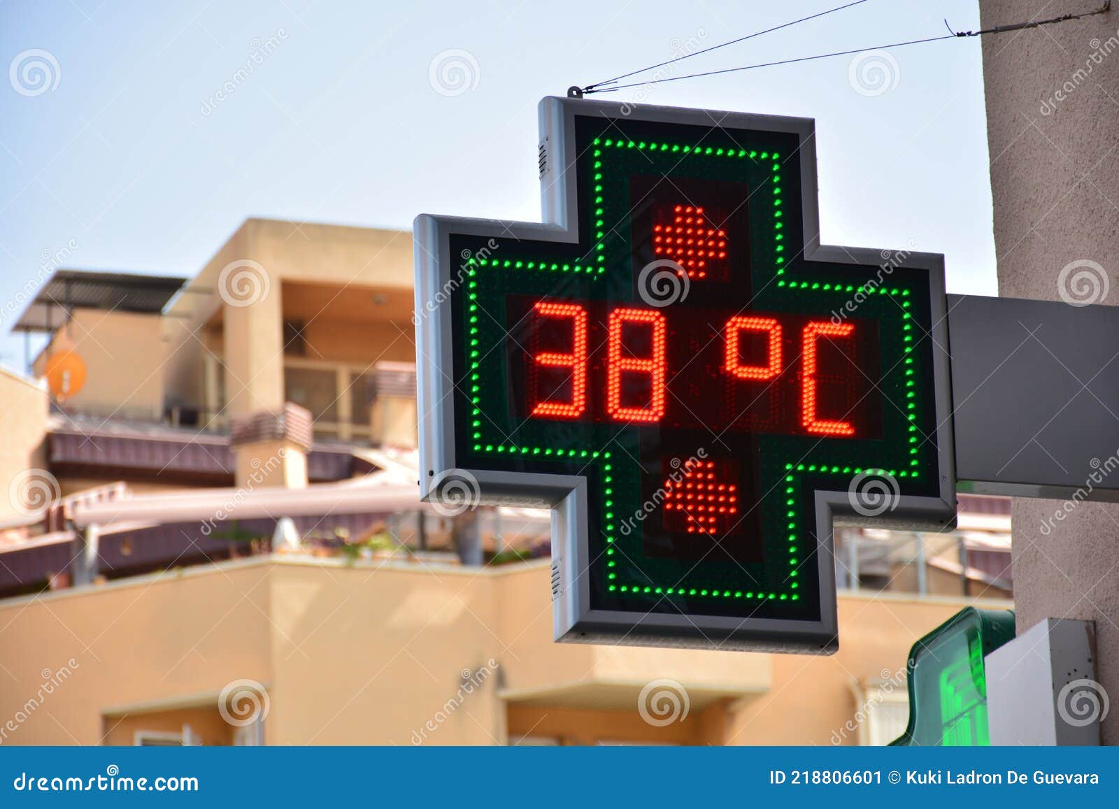 street thermometer marking 38 degrees