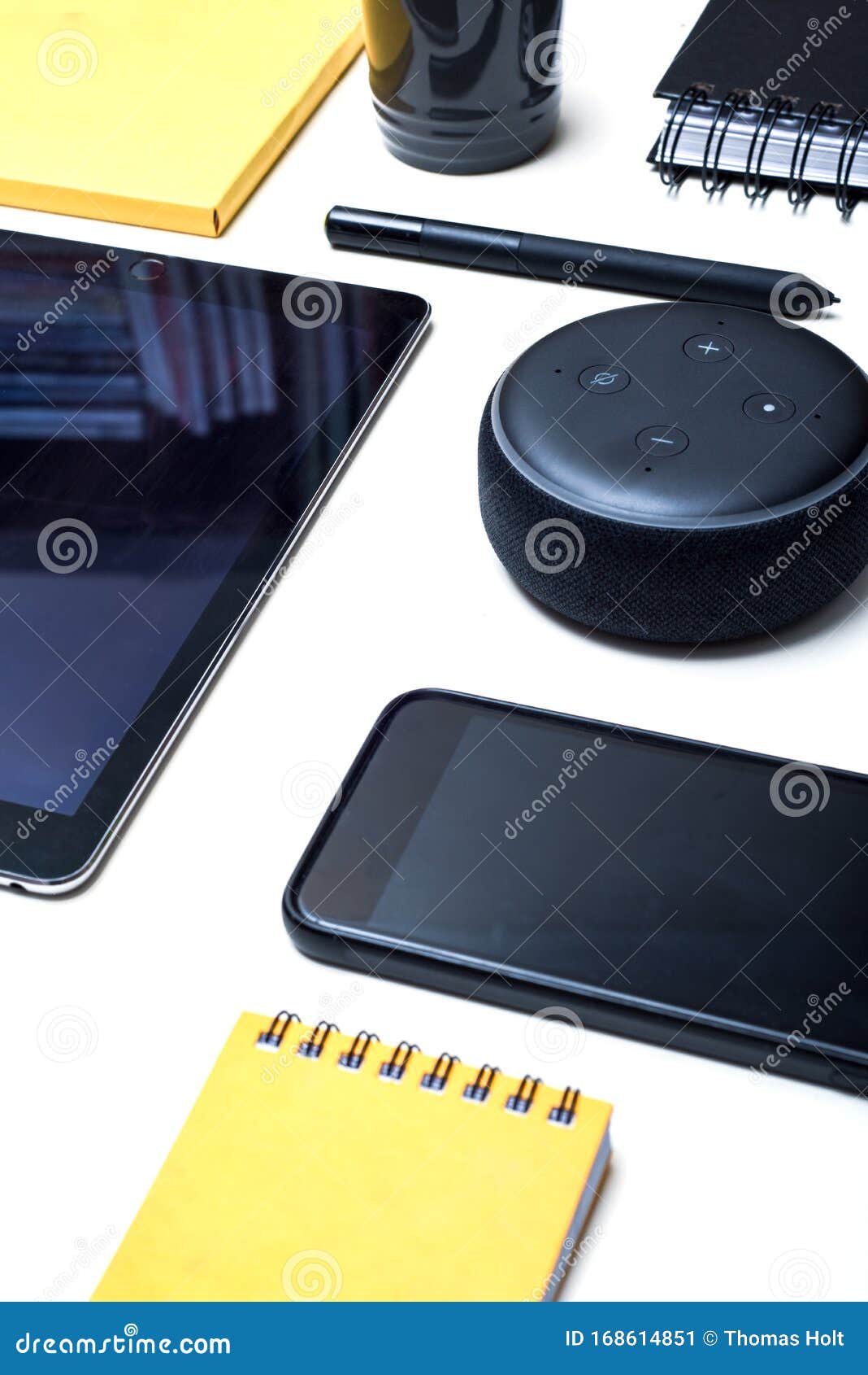 Digital And Wireless Technology Objects Arranged On A White Desk