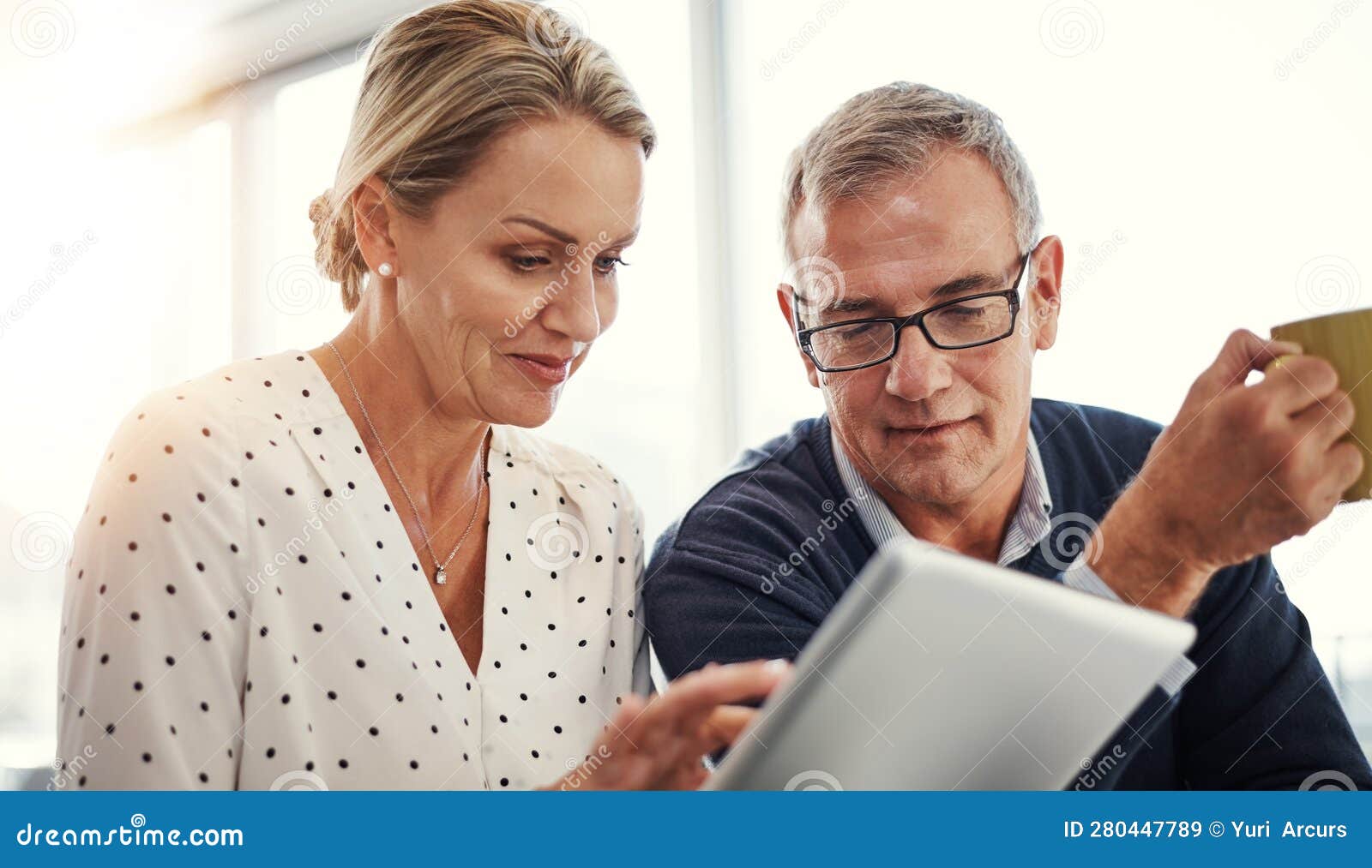Digitizing Bonding Time. a Mature Couple Using a Digital Tablet