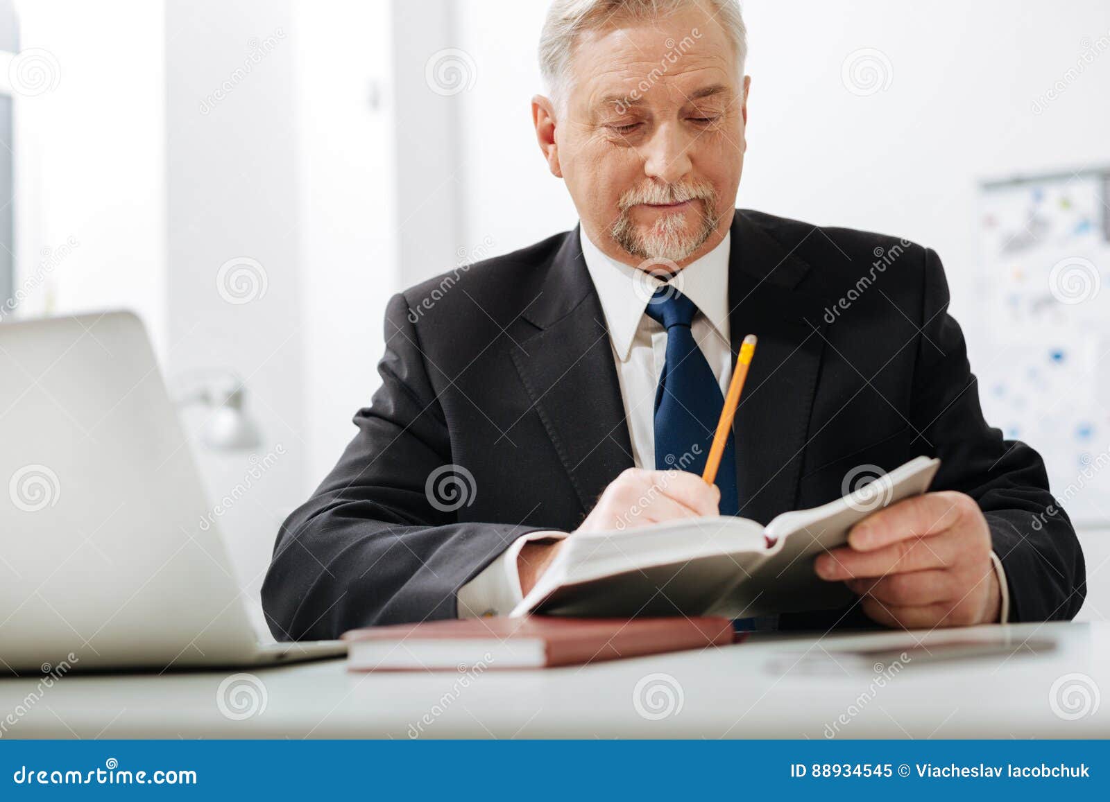 Diligent Aged Employer Checking Notes at Work Stock Image Image of