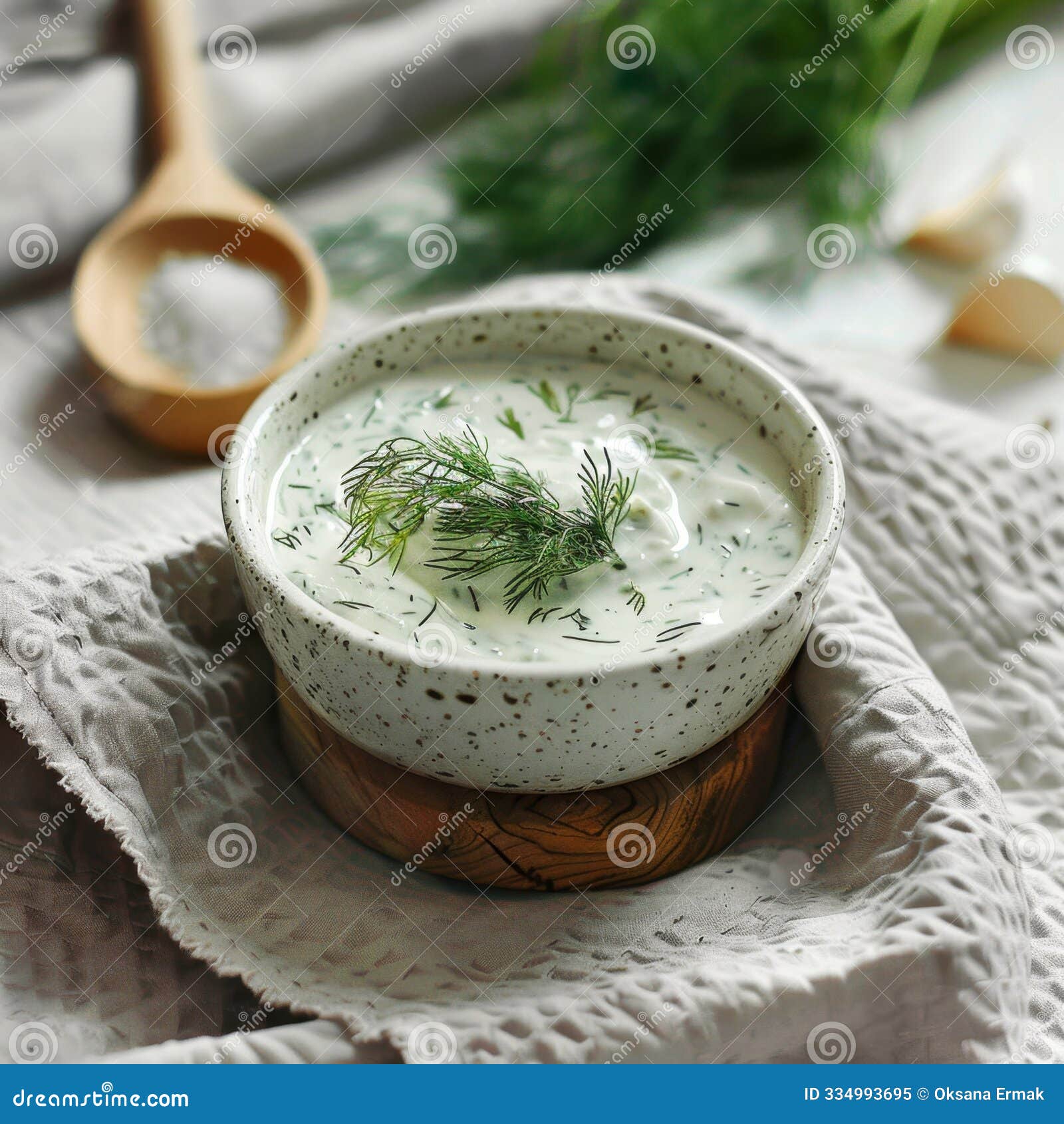 dill sauce in bowl, tzatziki greek dip, tarator, cacik or tartar with lemon, dill dressing, mayo, yogurt cream