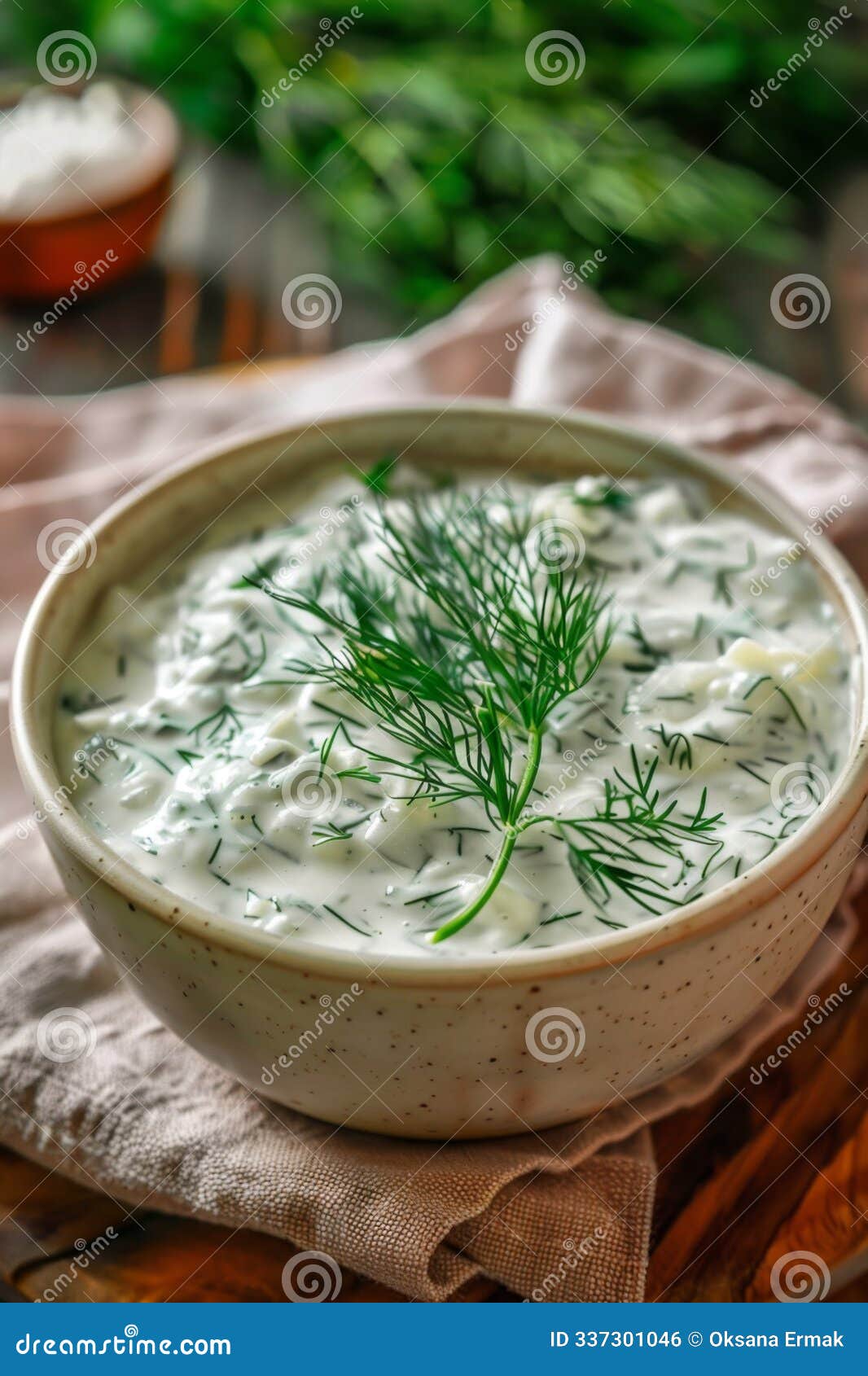 dill sauce in bowl, tzatziki greek dip, tarator, cacik or tartar with lemon, dill dressing, mayo, yogurt cream