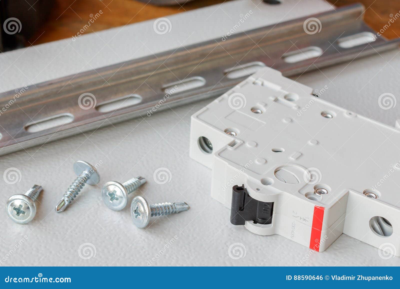 DIN Rail, Circuit Breaker and the Screws on the Mounting Plate Stock
