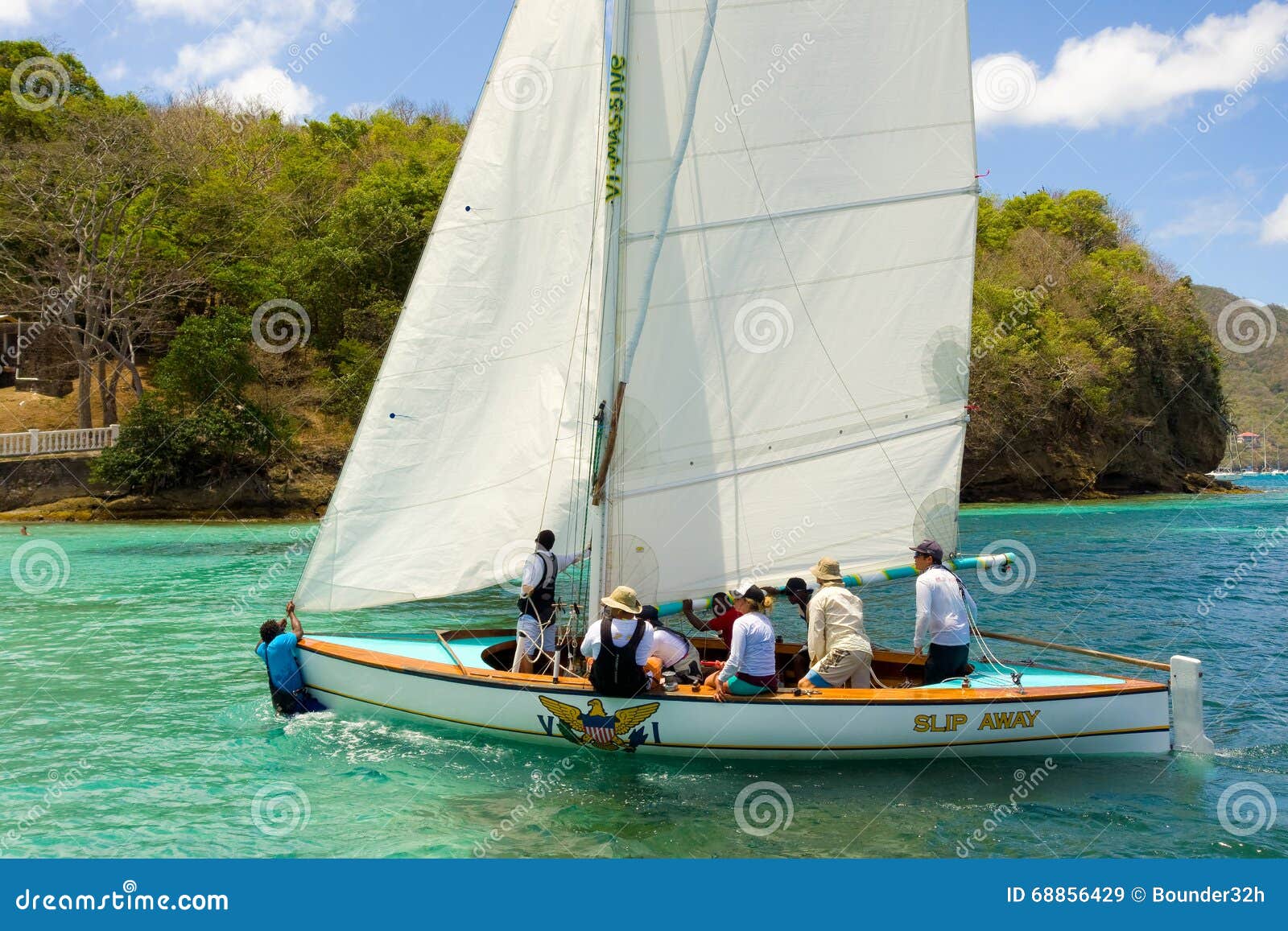 A Dinghy Arriving for a Race in the Caribbean Editorial Stock Image