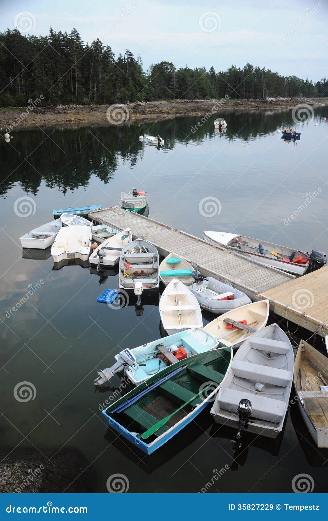 Royalty-Free photo: Red Blue and White Fishing Boats on Dock during Daytime