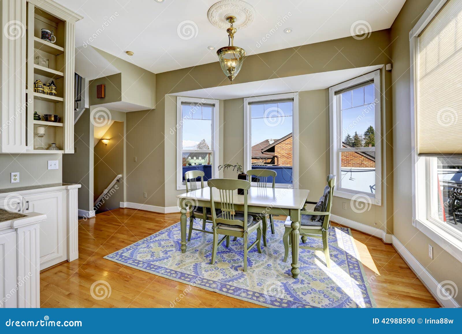 Dining Room With Green Wooden Table Set Stock Photo 