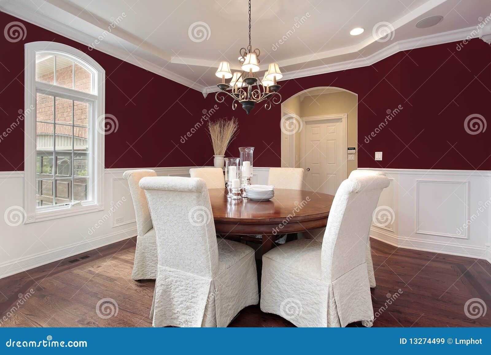 Dining room with red walls stock image. Image of luxury 13274499