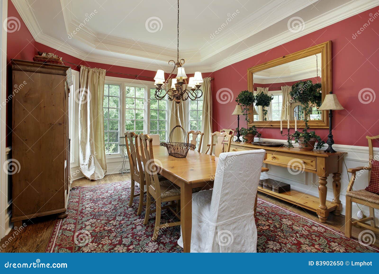 Dining room with red walls stock photo. Image of architecture - 83902650