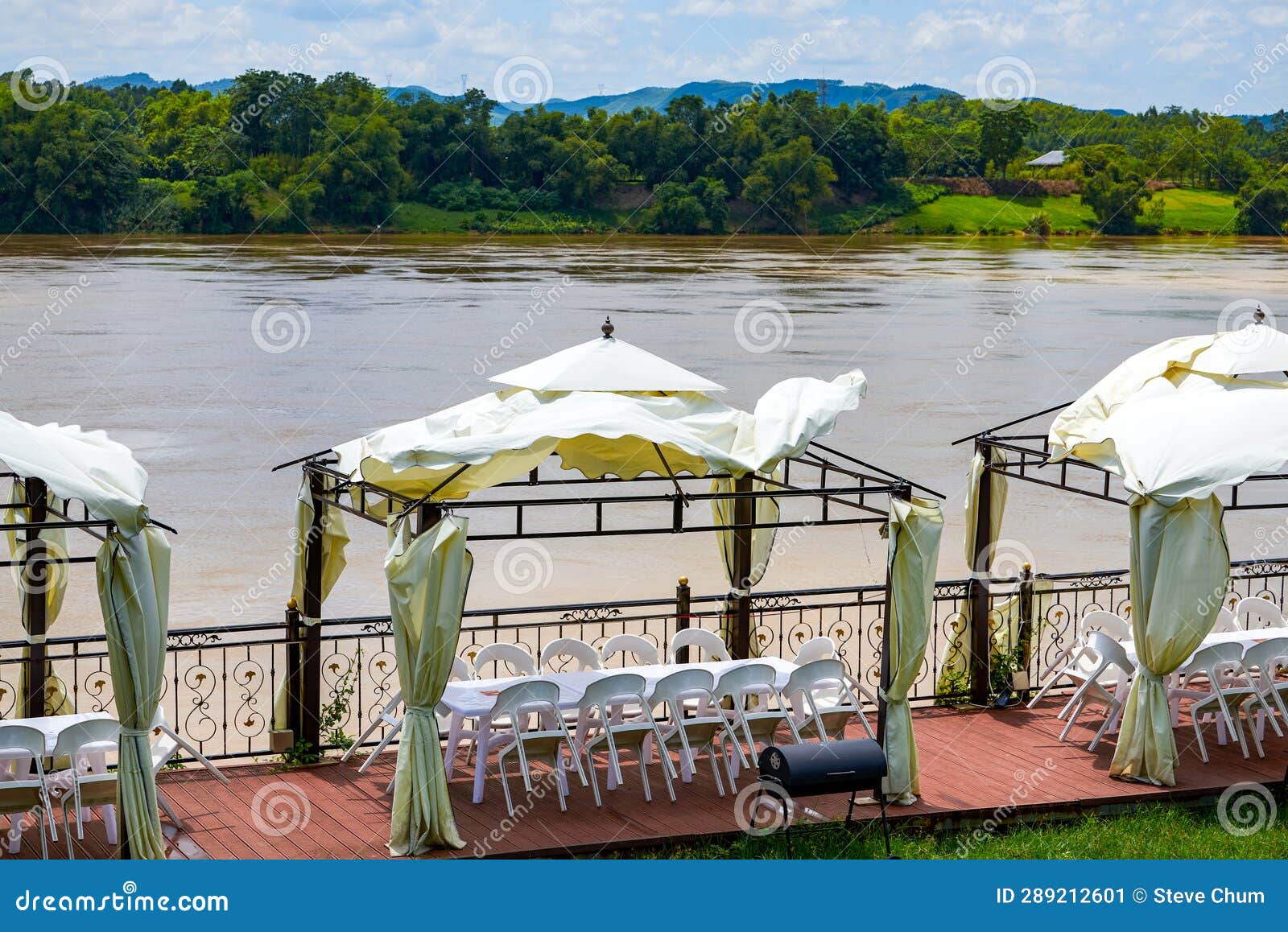 Dining Table and Chairs for Outdoor Riverside Banquets Stock Image
