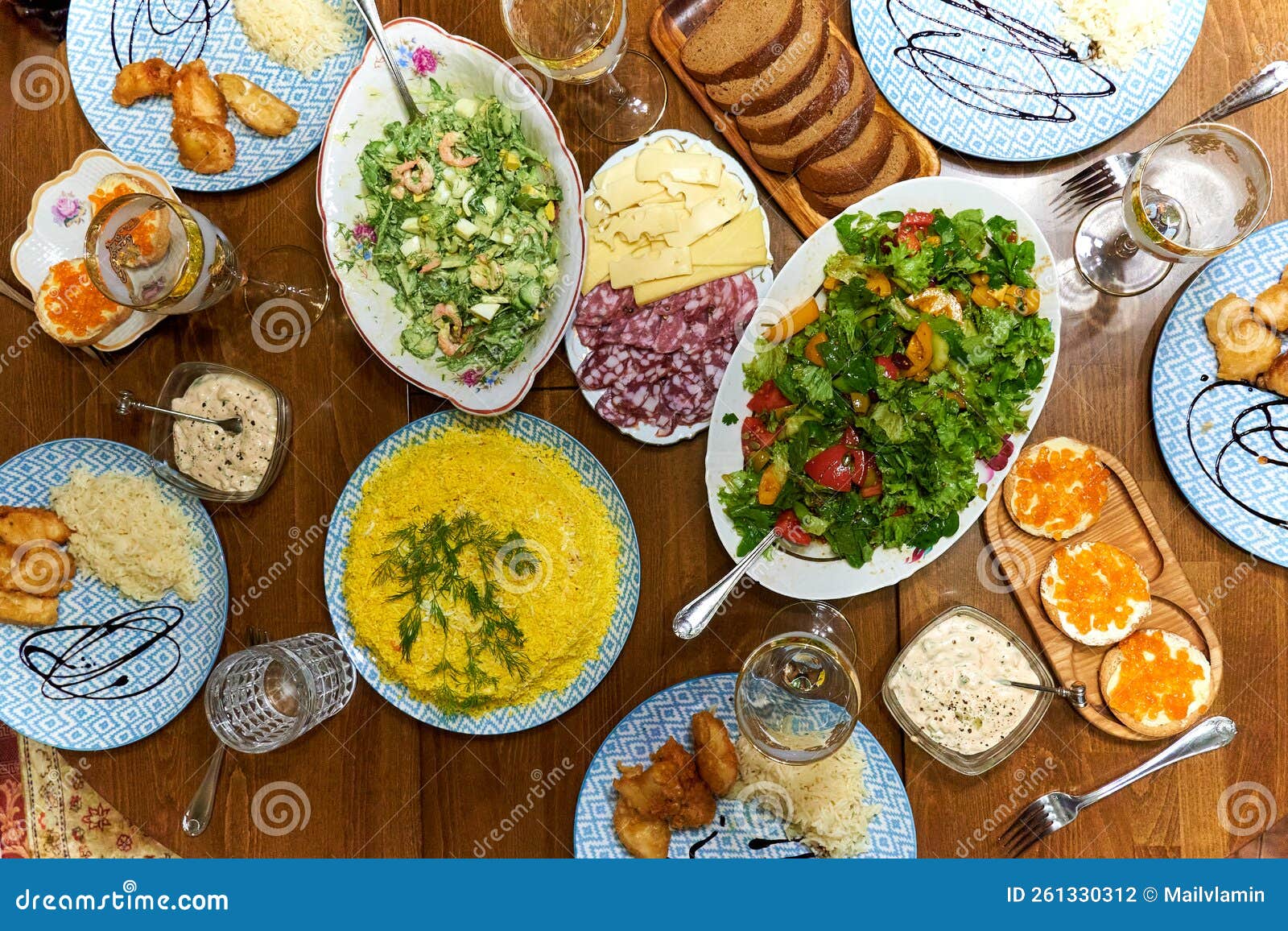 A Dinner Party, a Table Lined with a Variety of Dishes for Guests Stock