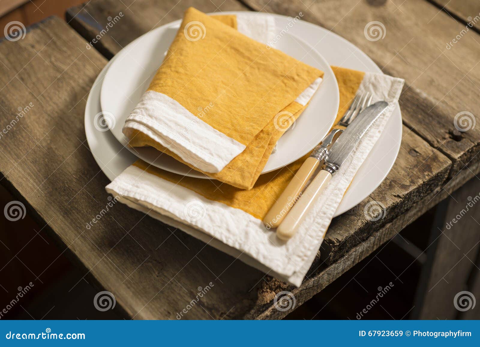 Dinner Plates and Orange Napkins Stack with Knife and Fork Stock Image Image of fork, utensil