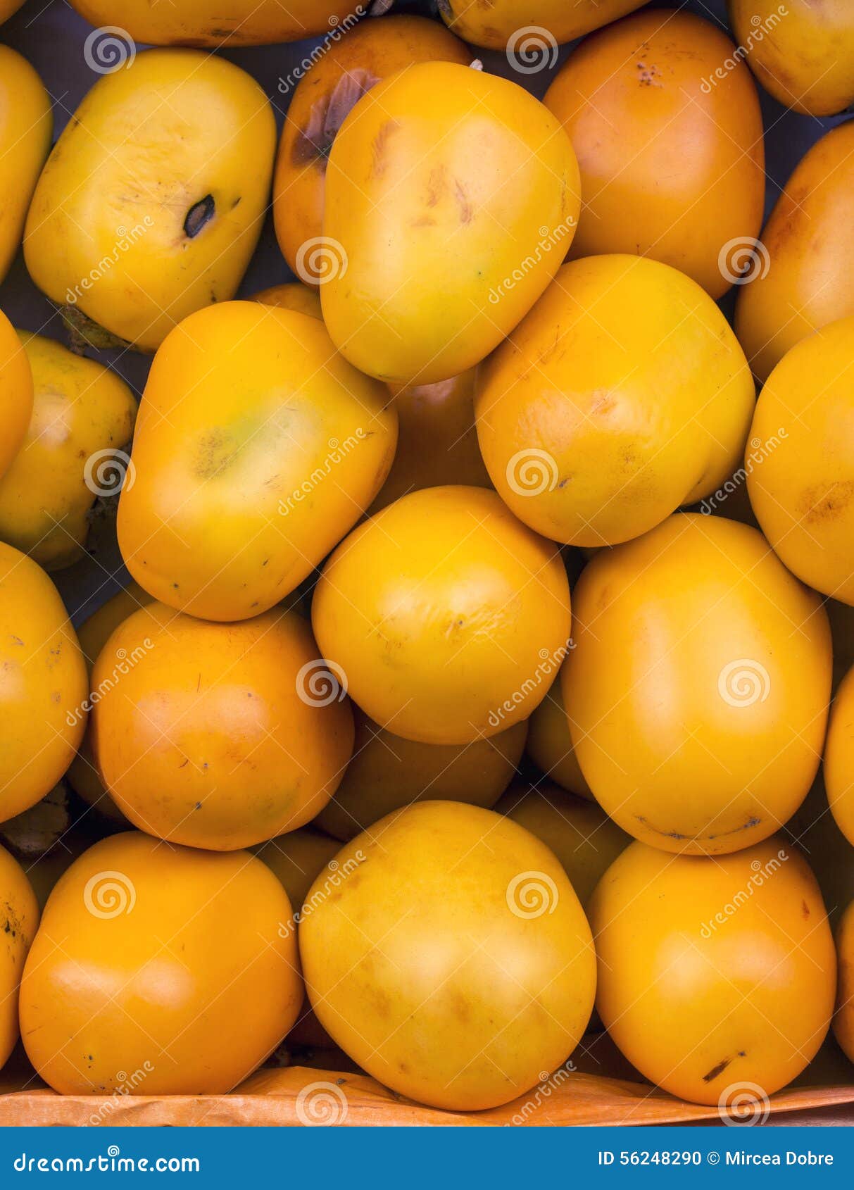 diospyros kaki (caqui) fruit in a market in peru.