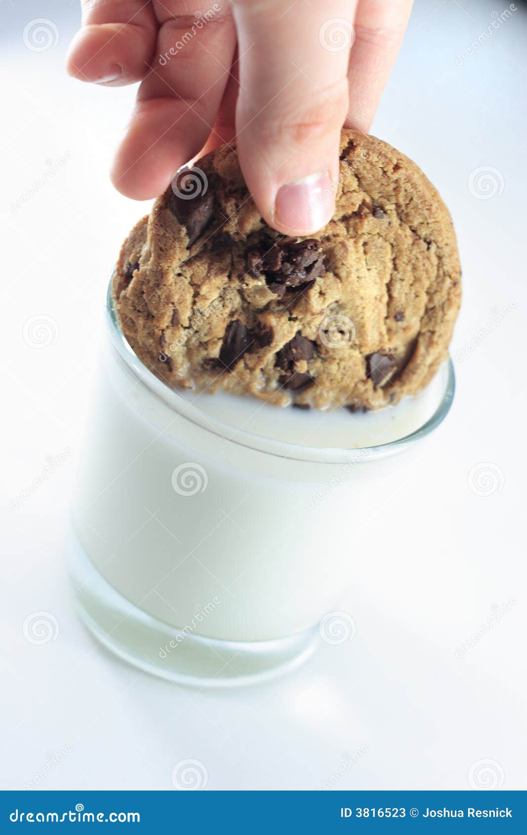 Dipping cookie in milk stock image. Image of dipped, plate 3816523