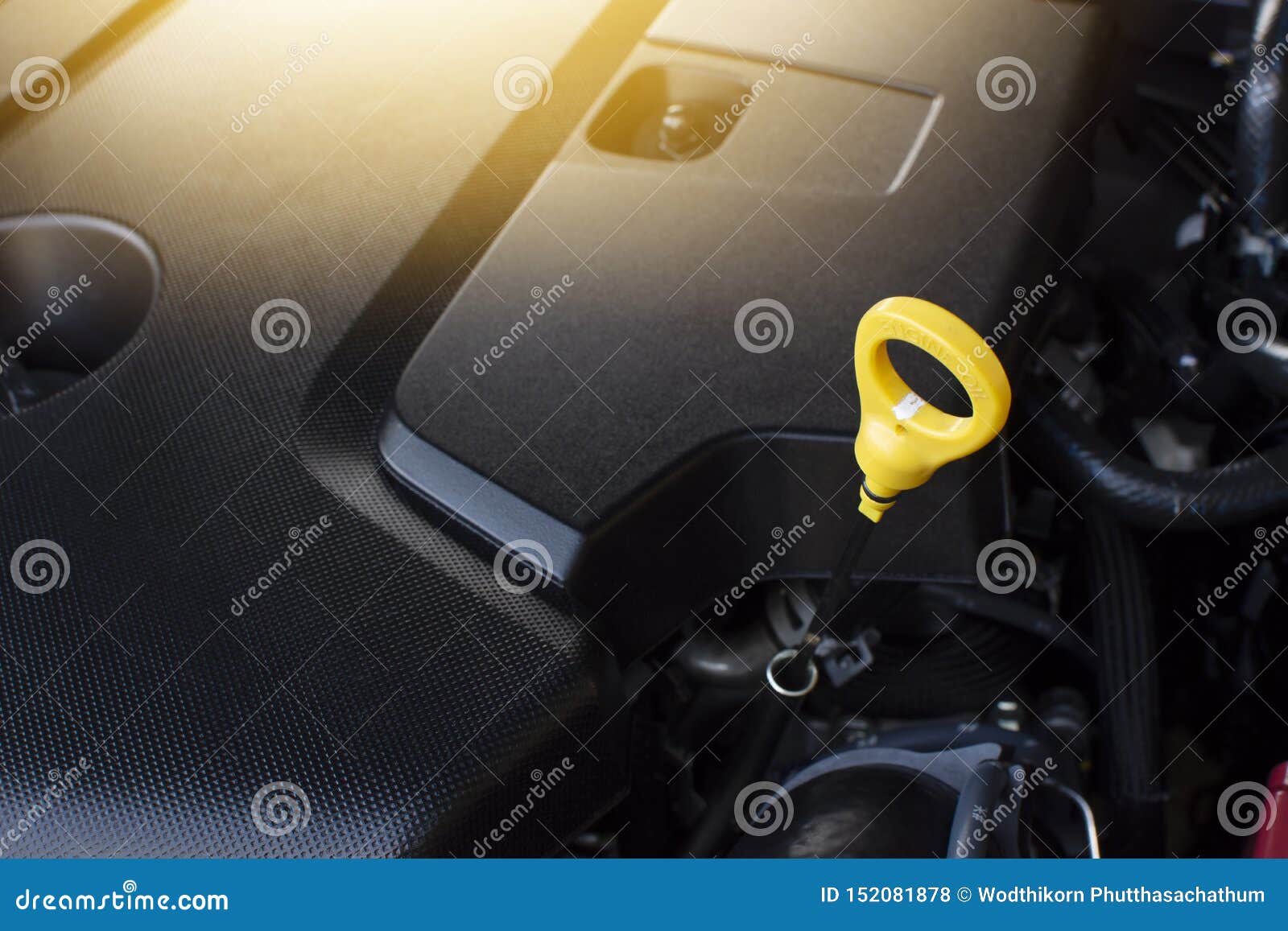 Dipstick Oil Level Gauge For Checking Engine Oil Level. Stock Photo