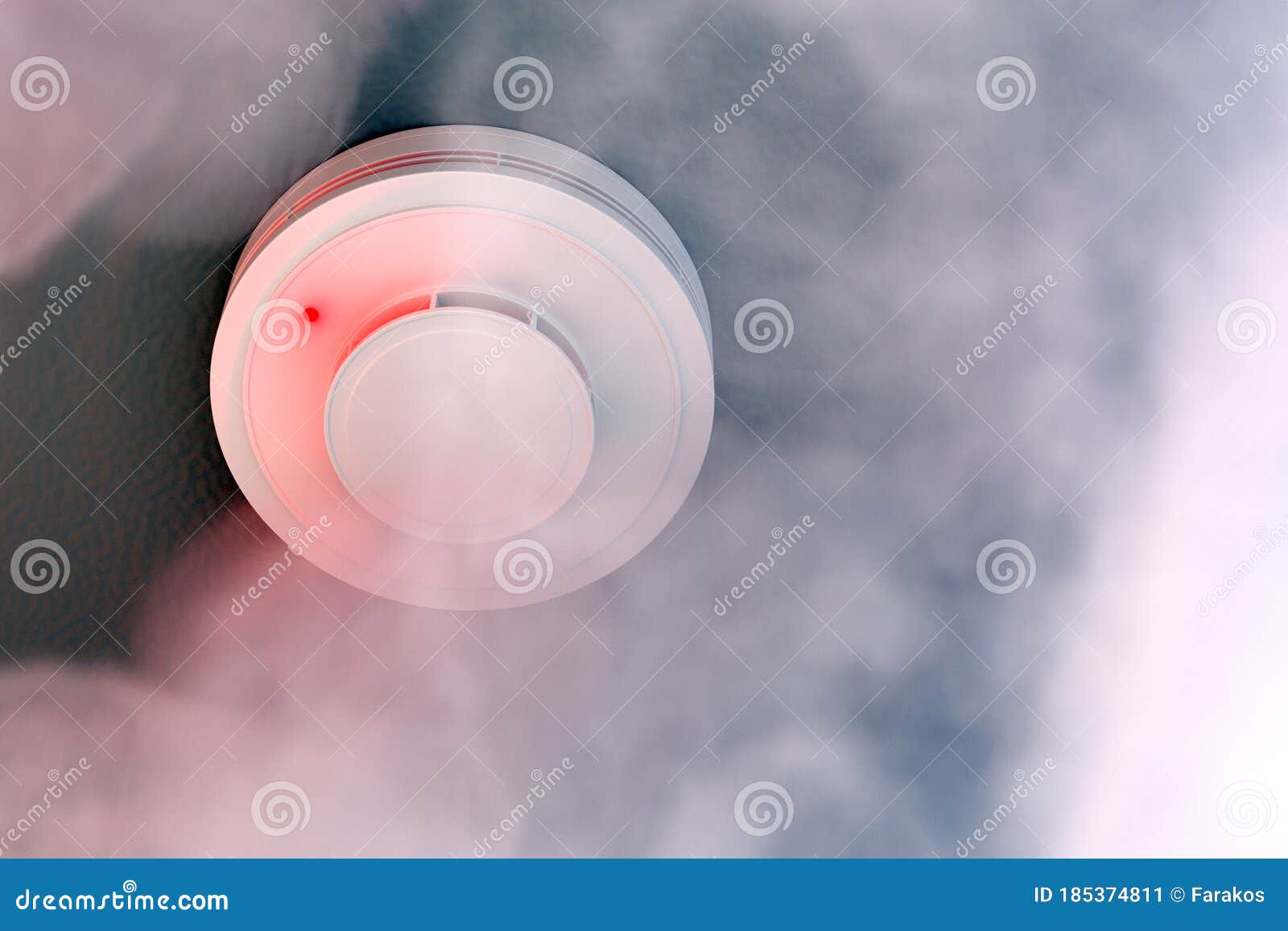 Dire Alarm Smoke Detector with Red LED Indicator on Ceiling Stock