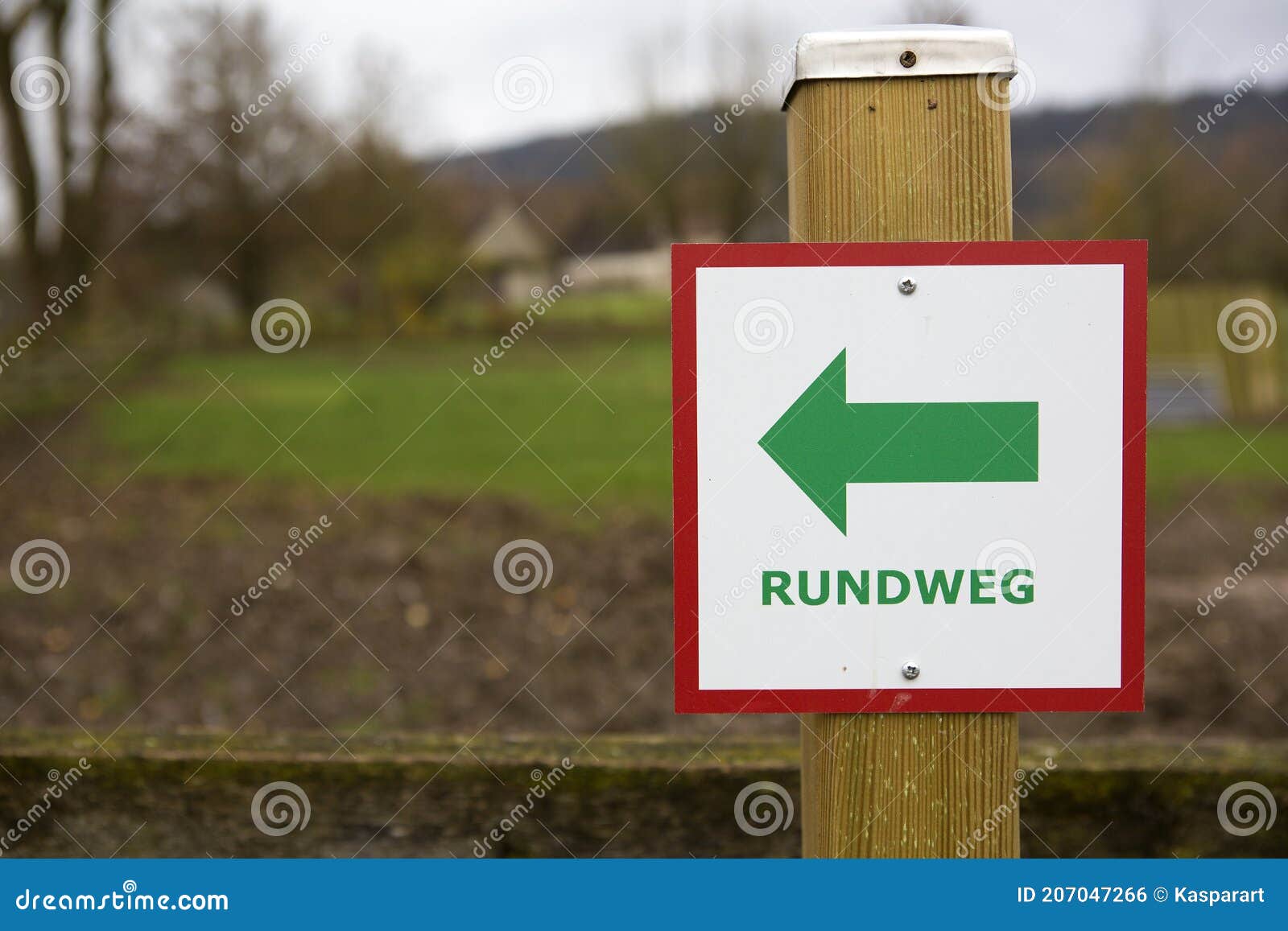 directional sign with the german text `rundweg` which translates into `circular walk` in english language