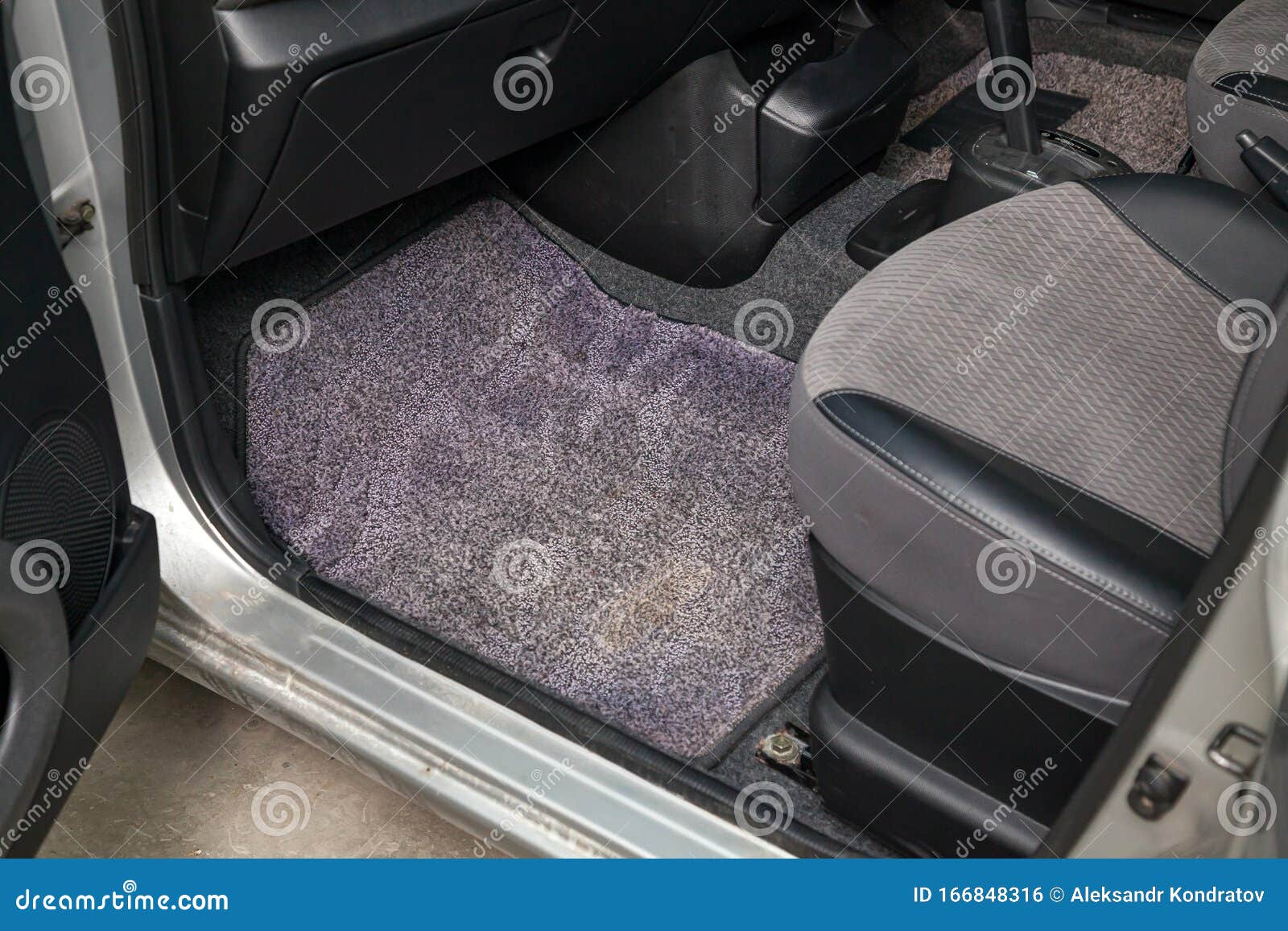 Dirty Car Floor Mats Of Gray Carpet Under Passenger Seat In The