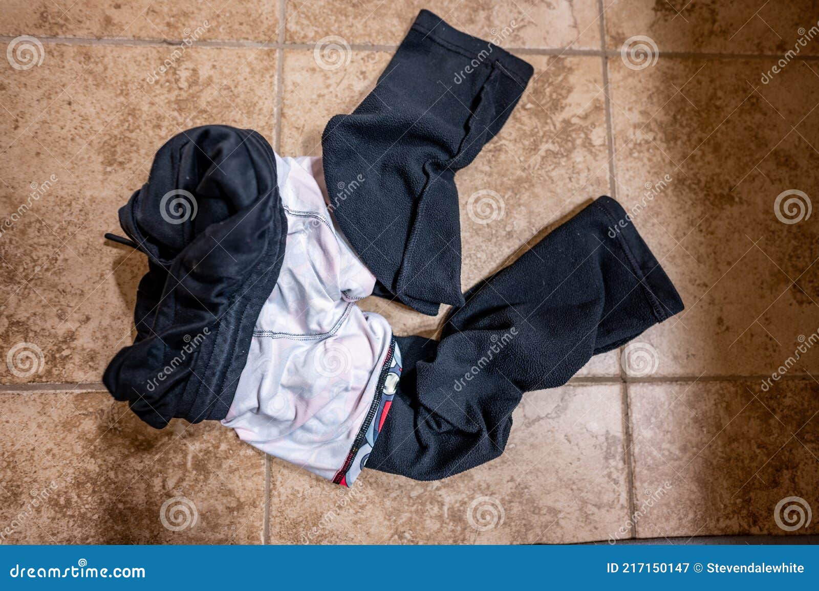 inside out reversed dirty cloths from a child tossed on the floor