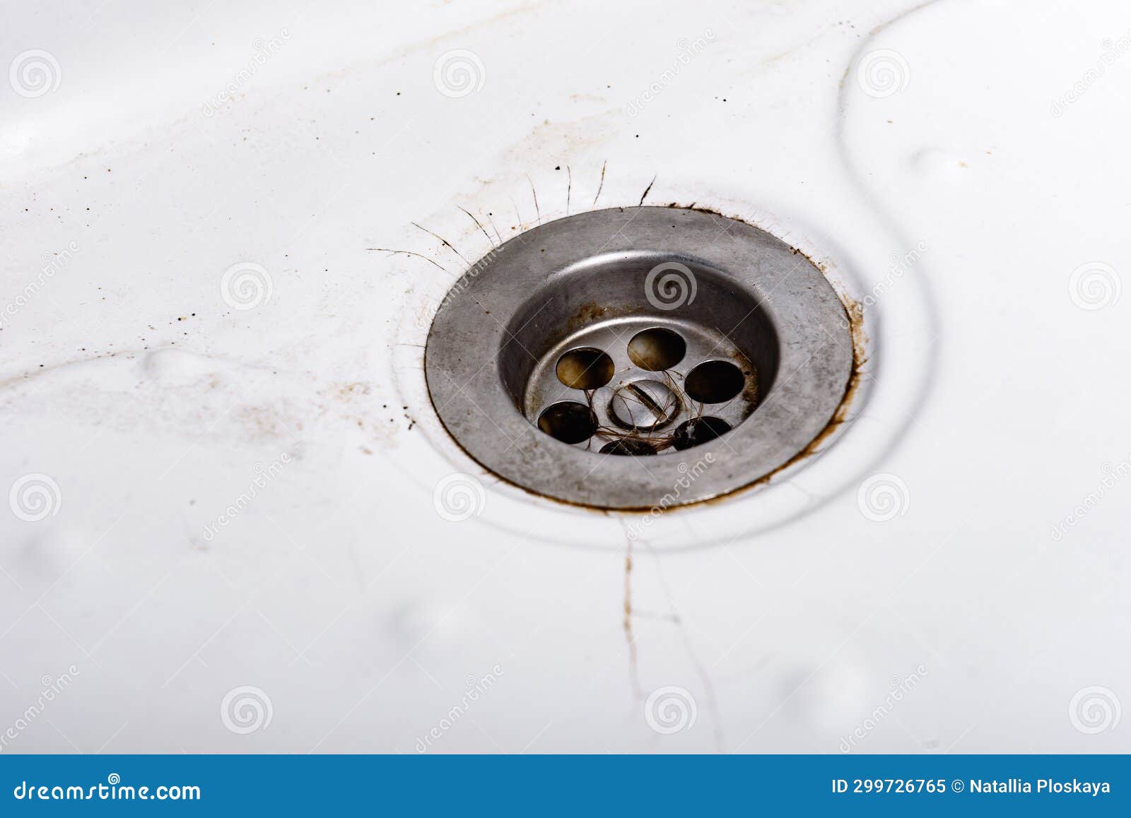 Dirty and Cracked Bathtub Surface with a Metal Drain Hole. Stock Image