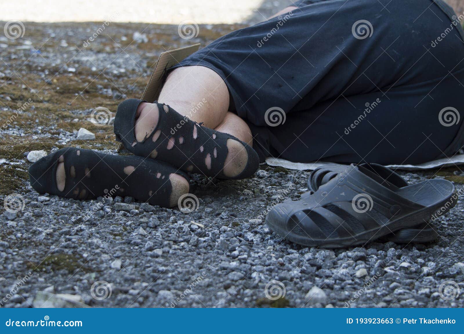 Dirty Feet of a Homeless Man in Torn Socks. Poverty and Hunger Stock ...