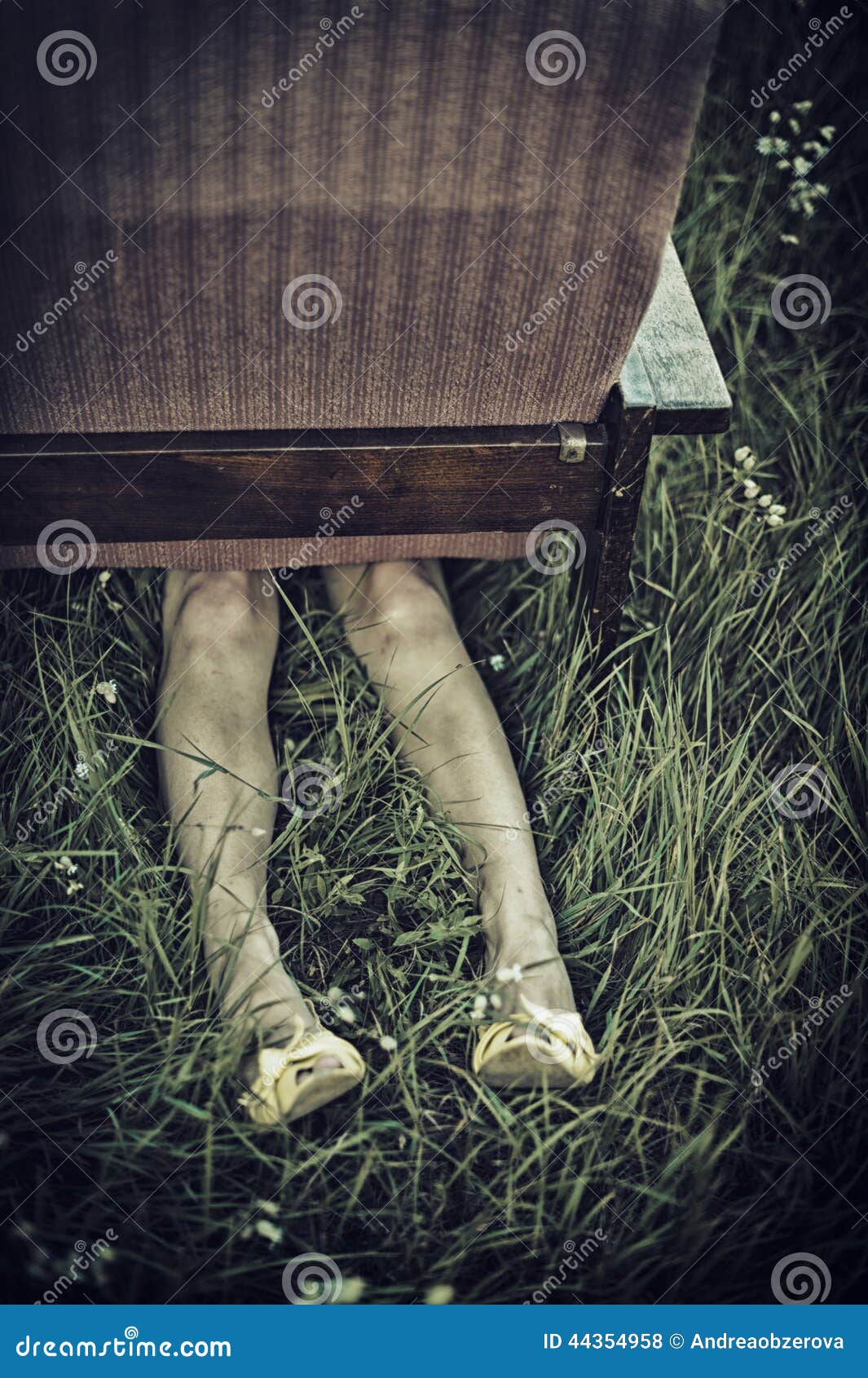 Dirty Female Legs Sticking Out from Under an Armchair in a Field ...