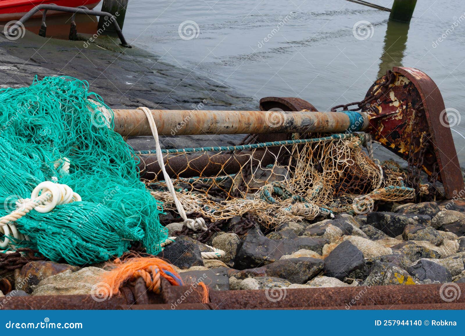 Dirty Old Fishing Net on the Dock Stock Photo - Image of pile