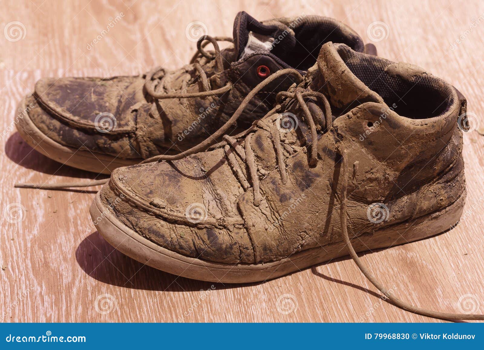 Dirty Shoes with Dried Mud on the Floor Stock Photo - Image of background,  pair: 79968830