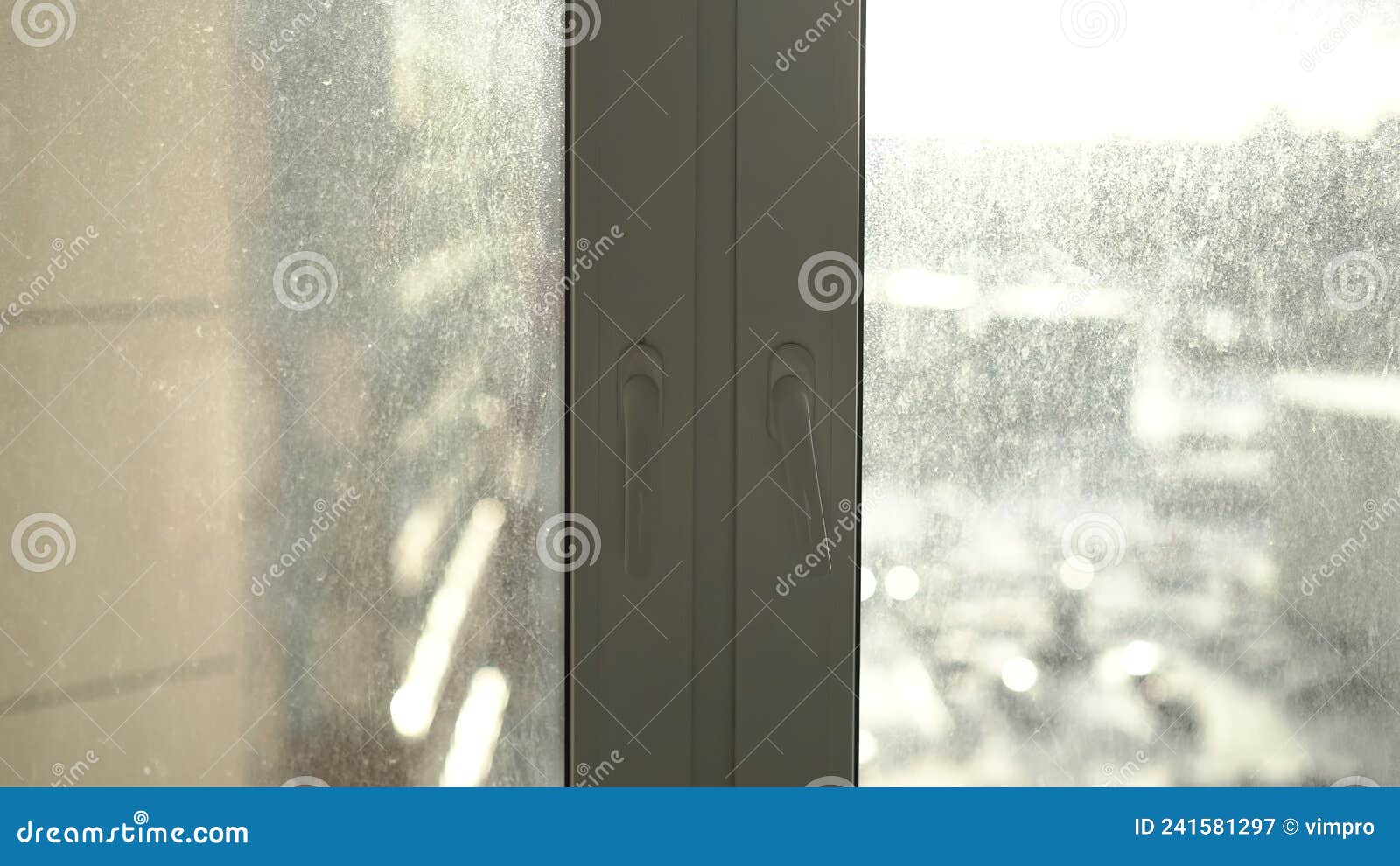 dirty window. glass stained with dust, dirt and drops of rain and snow.