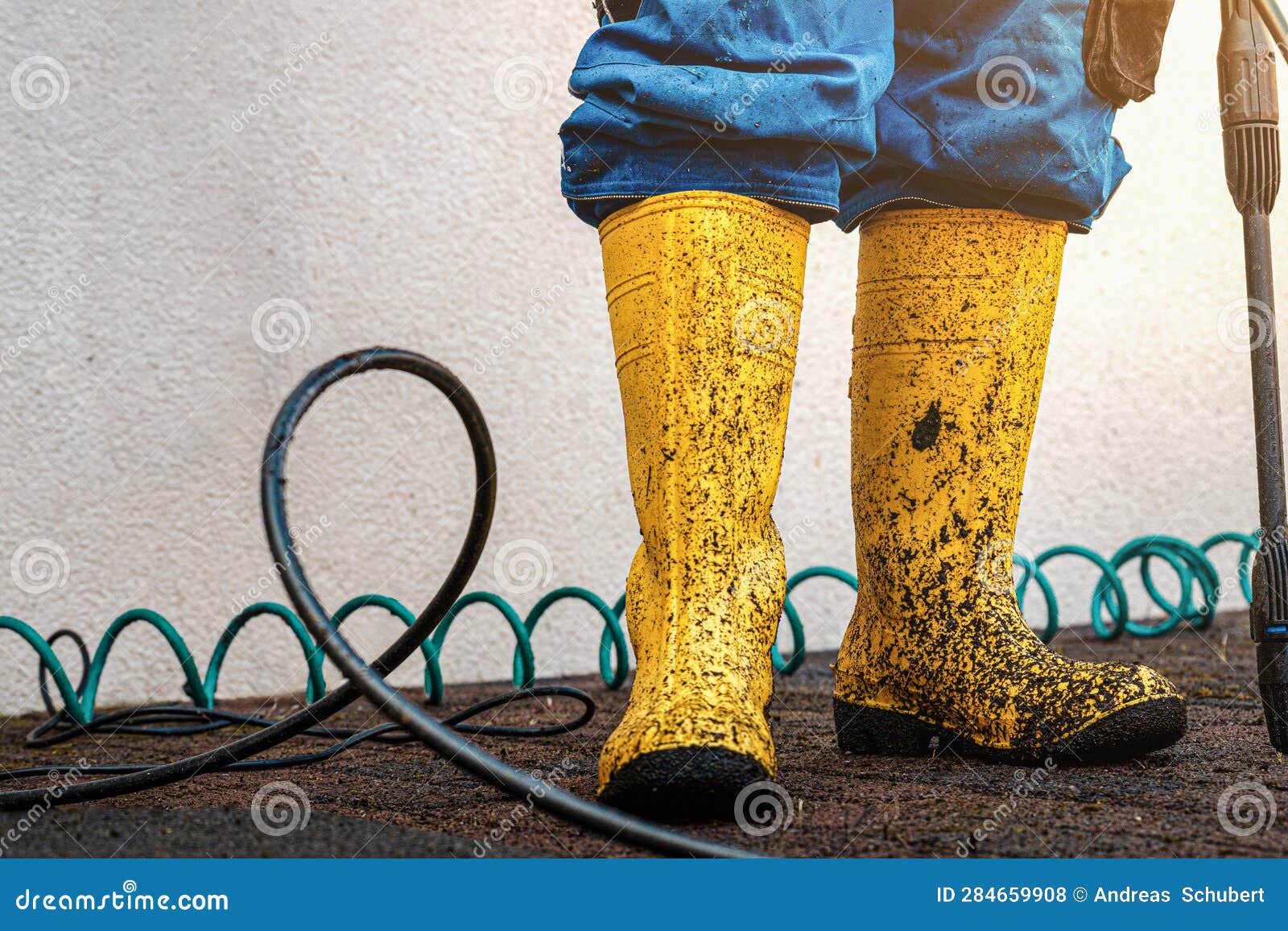 Dirty Yellow Rubber Shoes after Cleaning the Floor with Water Sprayer ...