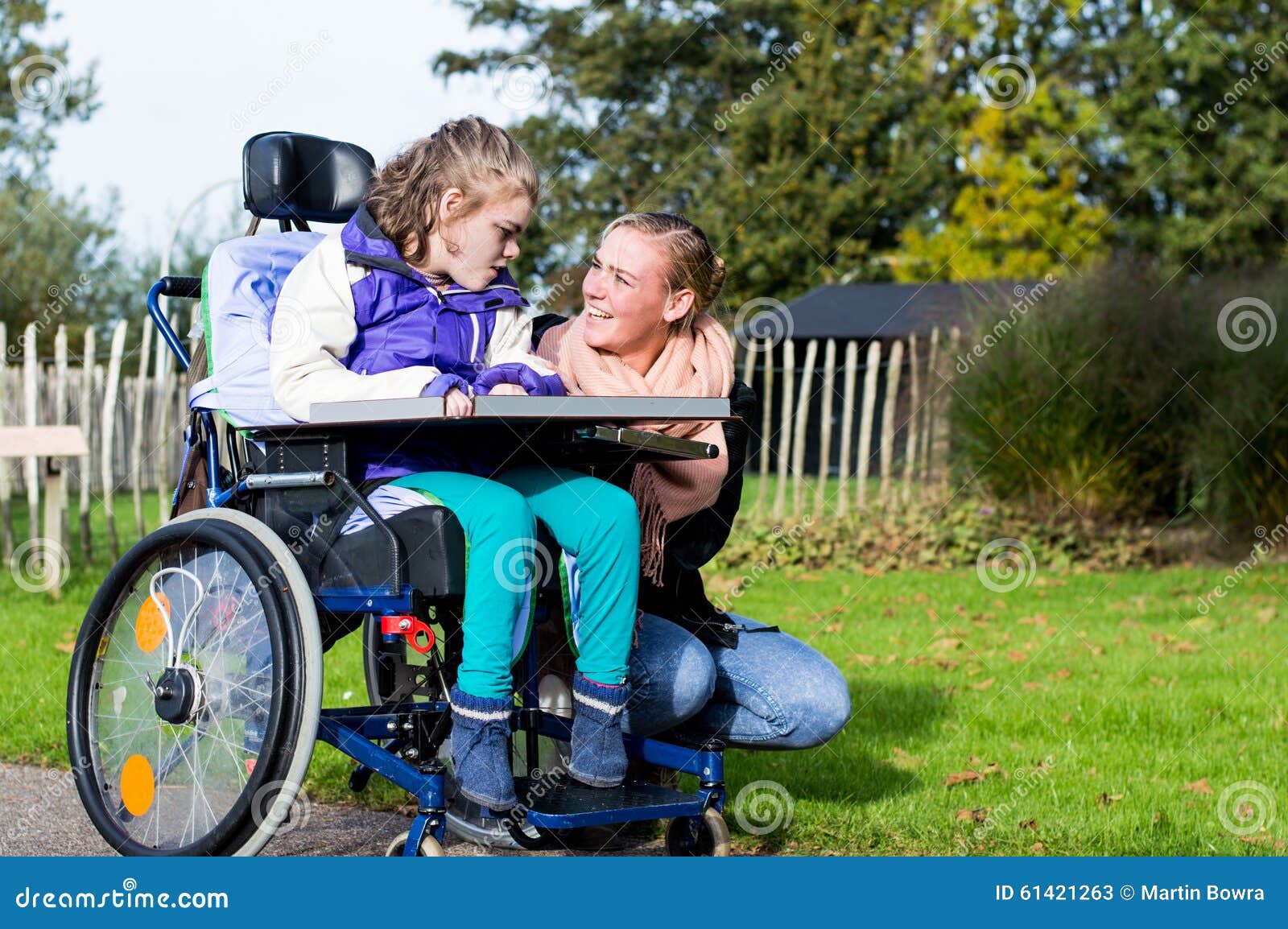 disabled girl in a wheelchair relaxing outside