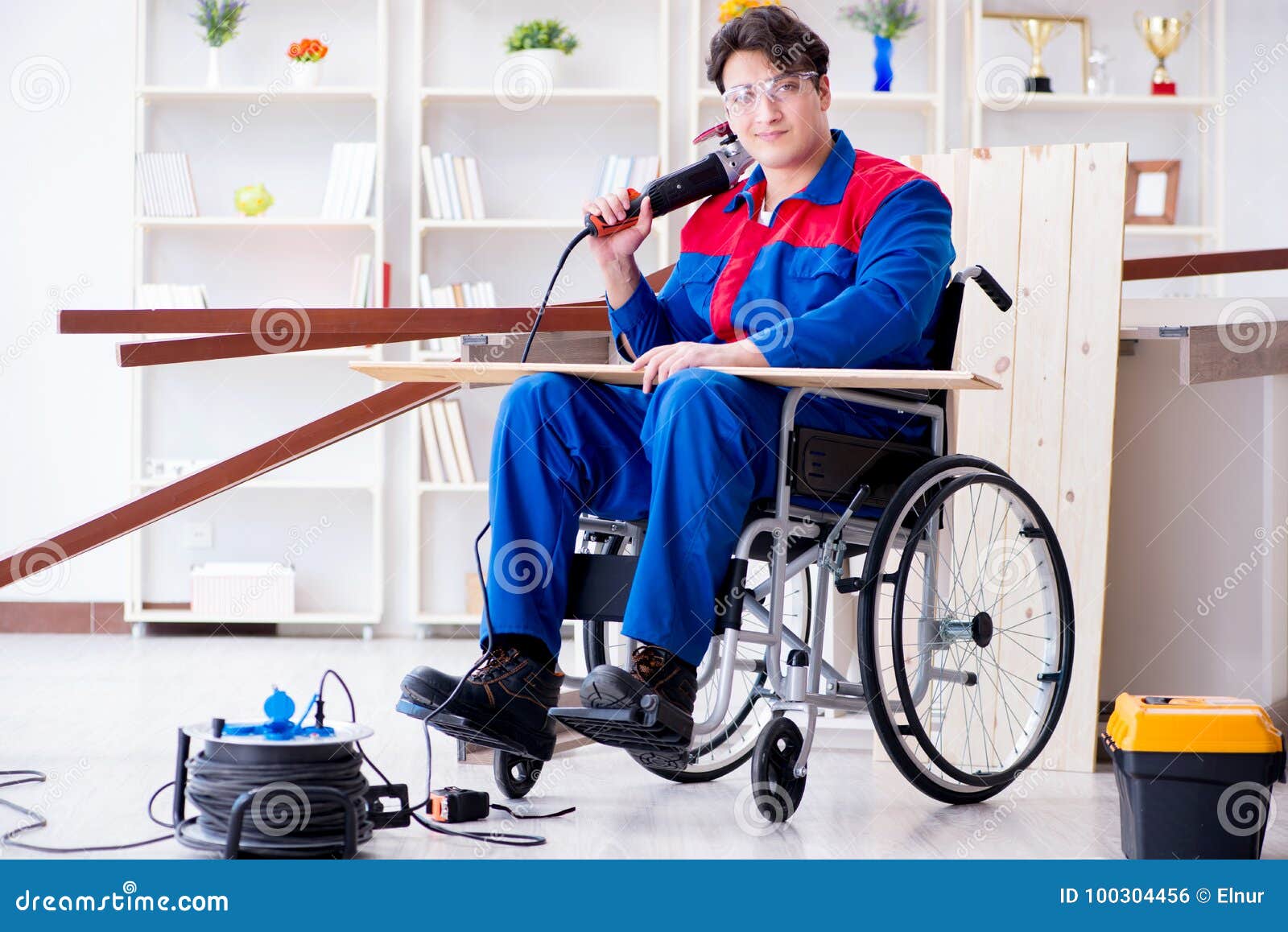 The Disabled Carpenter Working With Tools In Workshop 
