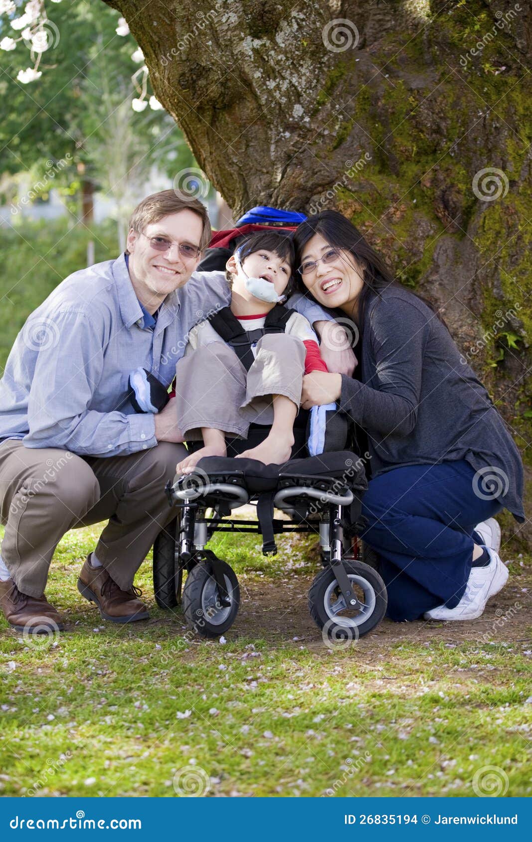 Disabled Child Surrounded by Parents Stock Photo Image of healthy