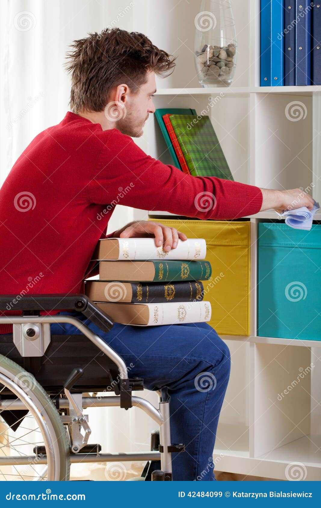 disabled holding a book and wiped the dust