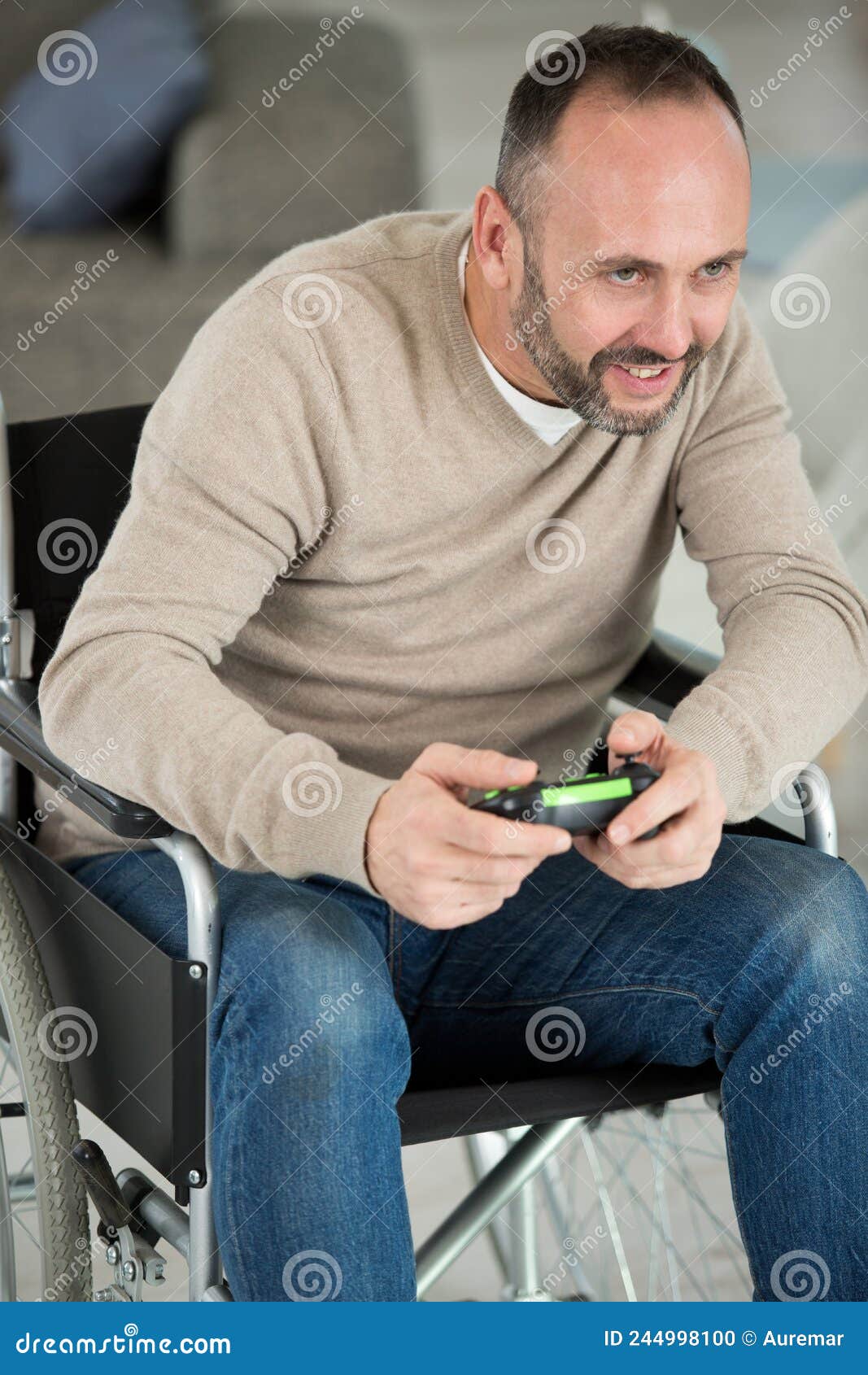 Disabled Man Playing Computer Games during Rehabilitation Stock Photo