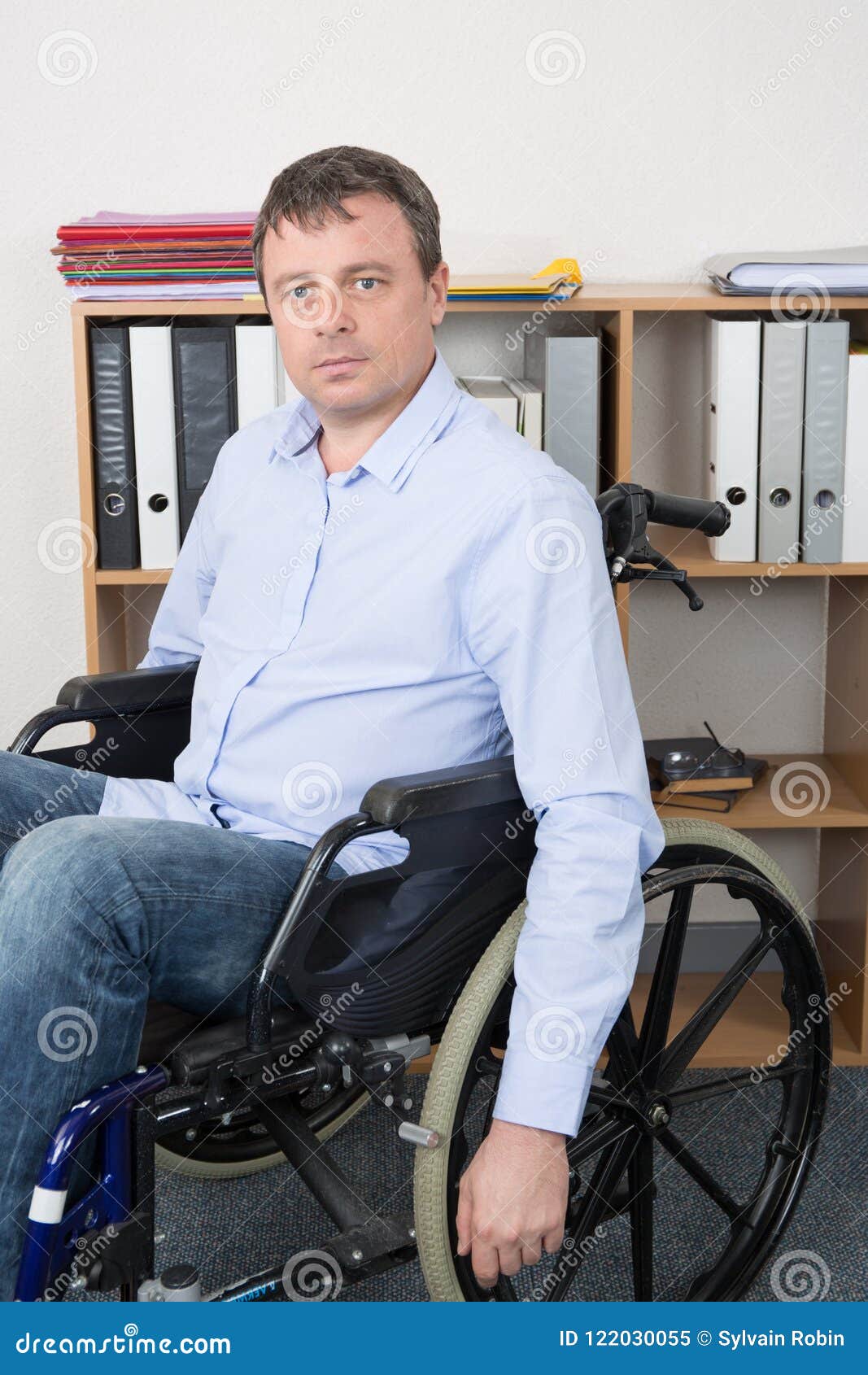 Disabled Man in Wheelchair Looking at Camera at Office Job Stock Image ...